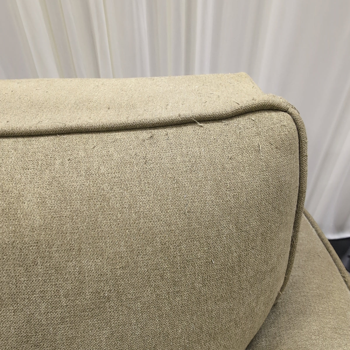 Tan Fabric Three-Cushion Couch with Rolled Arms