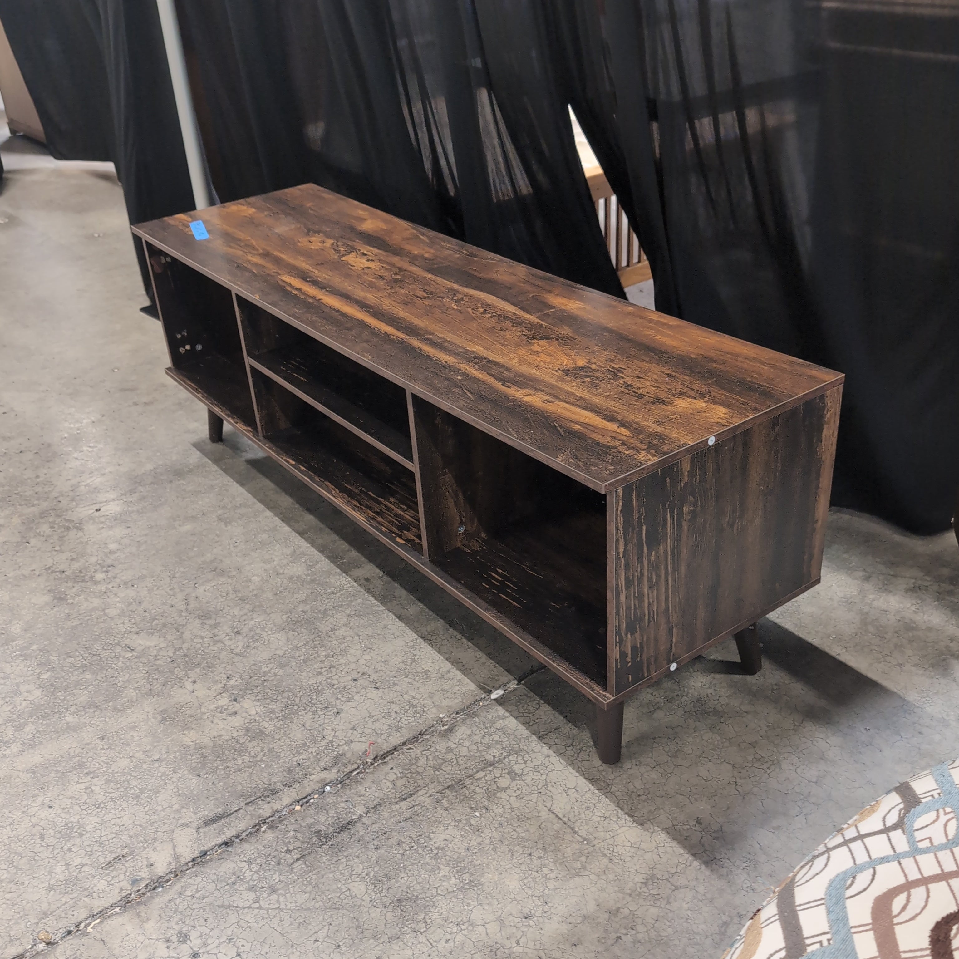 Distressed Dark Wood Multi-Shelf TV Stand with Tapered Legs