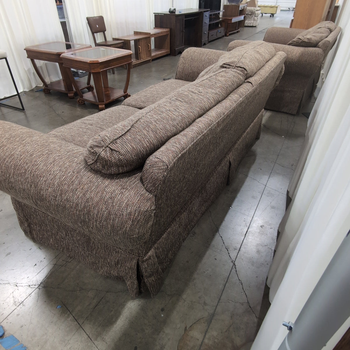 Textured Brown Rolled Arm Couch with Skirted Base