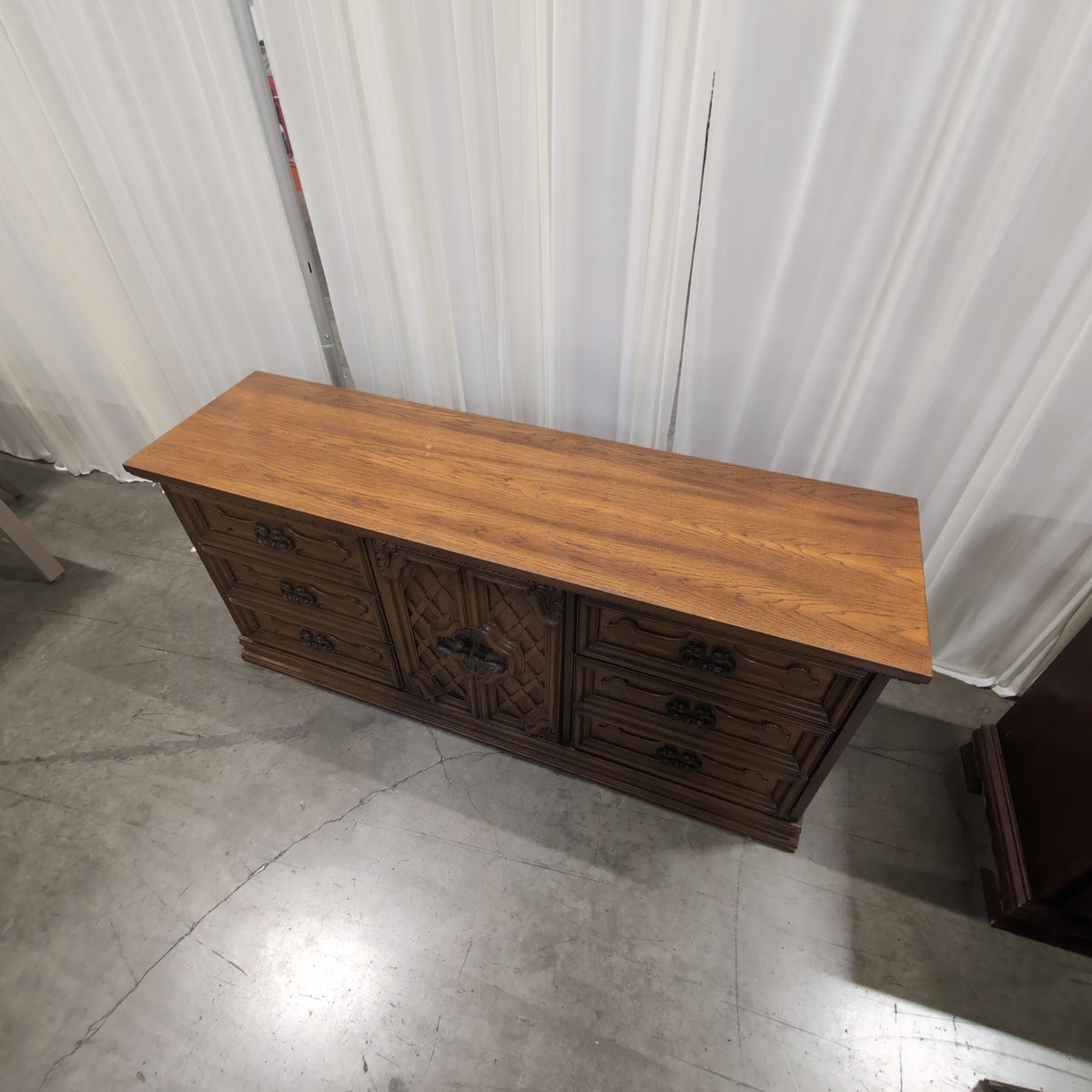 Traditional Brown Wood Dresser with Ornate Hardware