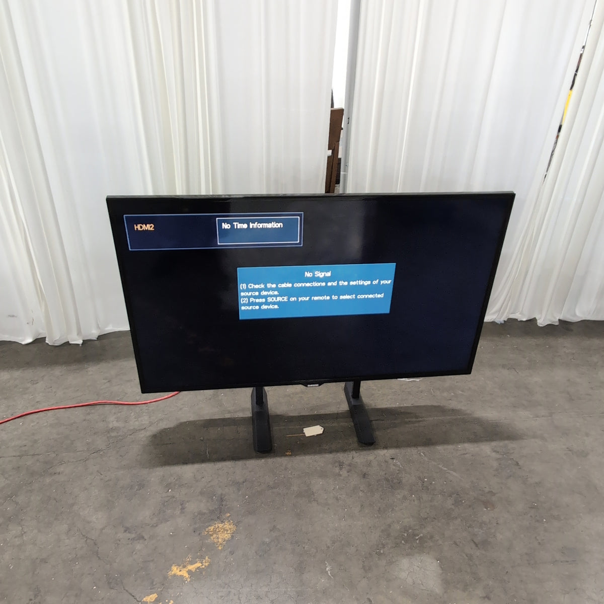 SAMSUNG Black Flat Screen Television with Stand