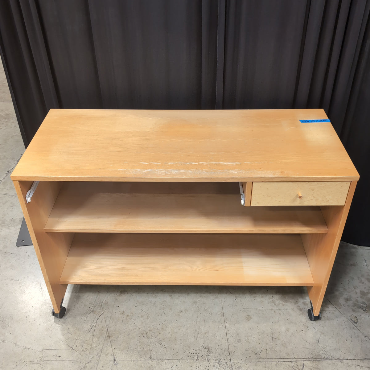 Light Wood Three-Shelf Bookcase with Casters