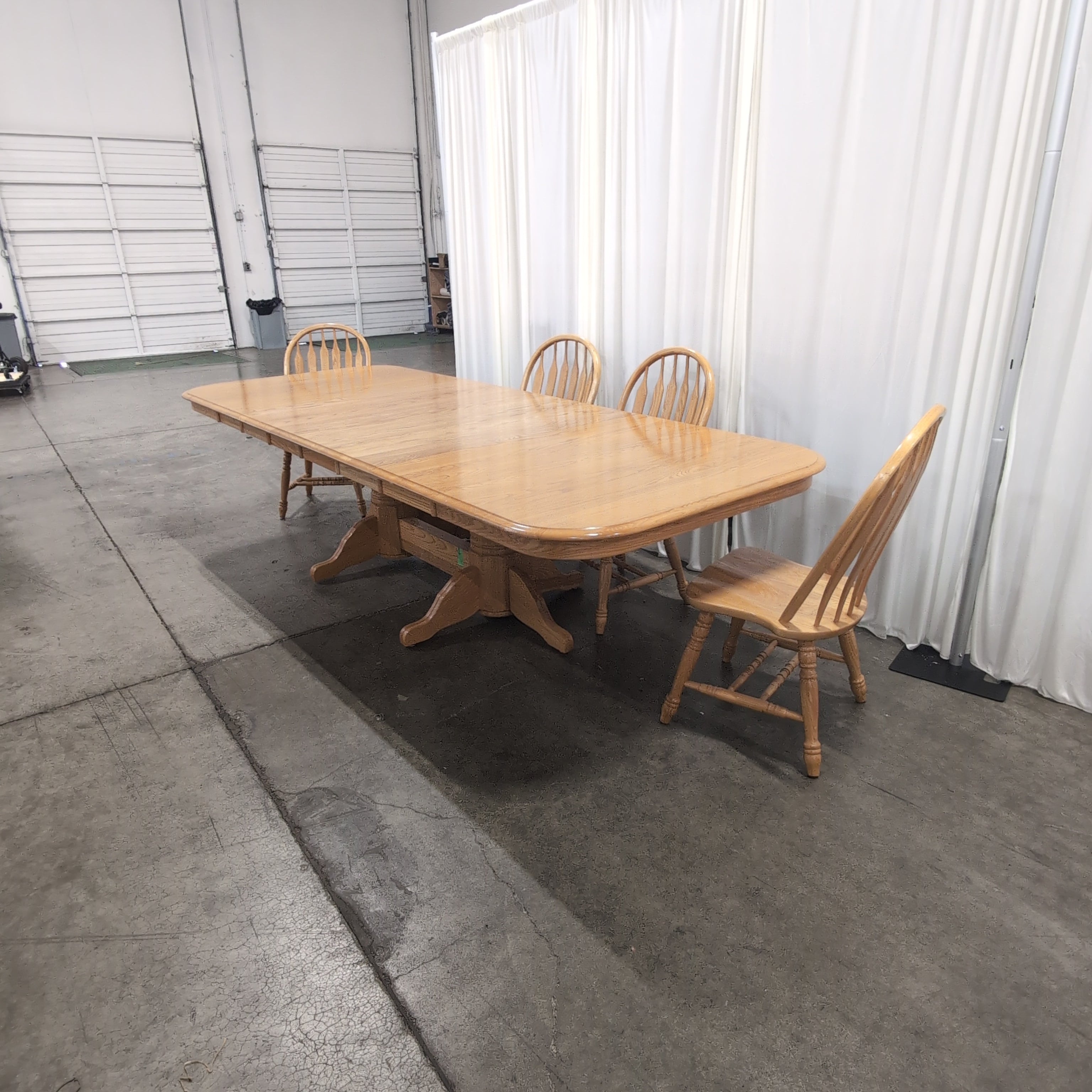 Light Wood Pedestal Dining Table with Four Windsor Chairs