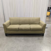 Tan Fabric Three-Cushion Couch with Rolled Arms