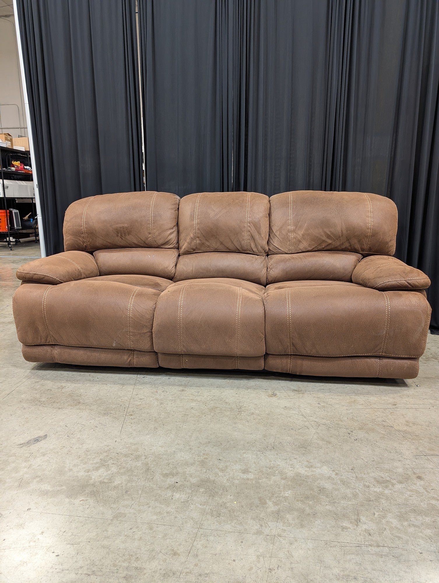 Brown Faux Leather Three-Seat Reclining Couch