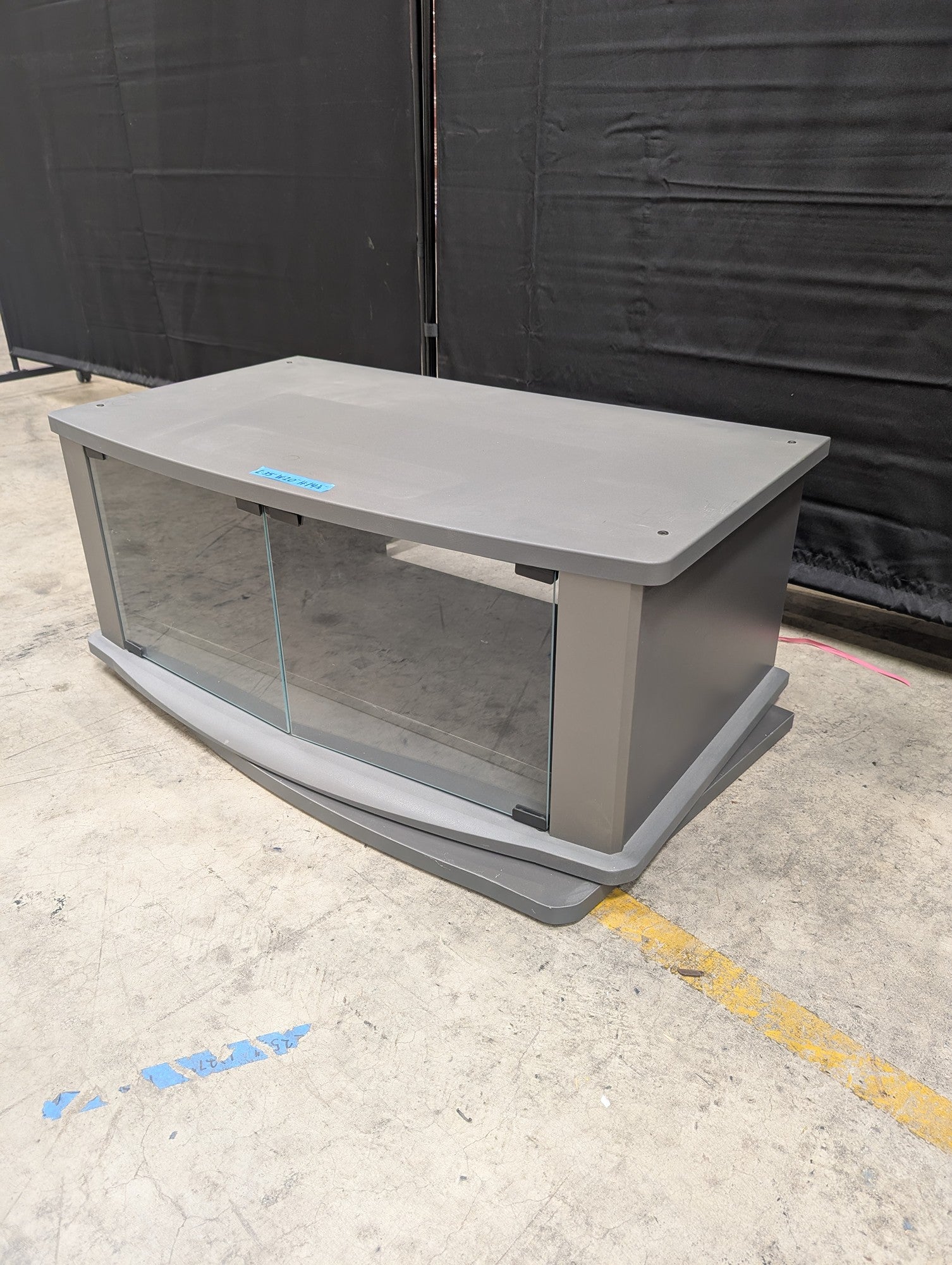 Gray Wood Composite TV Stand with Glass Doors