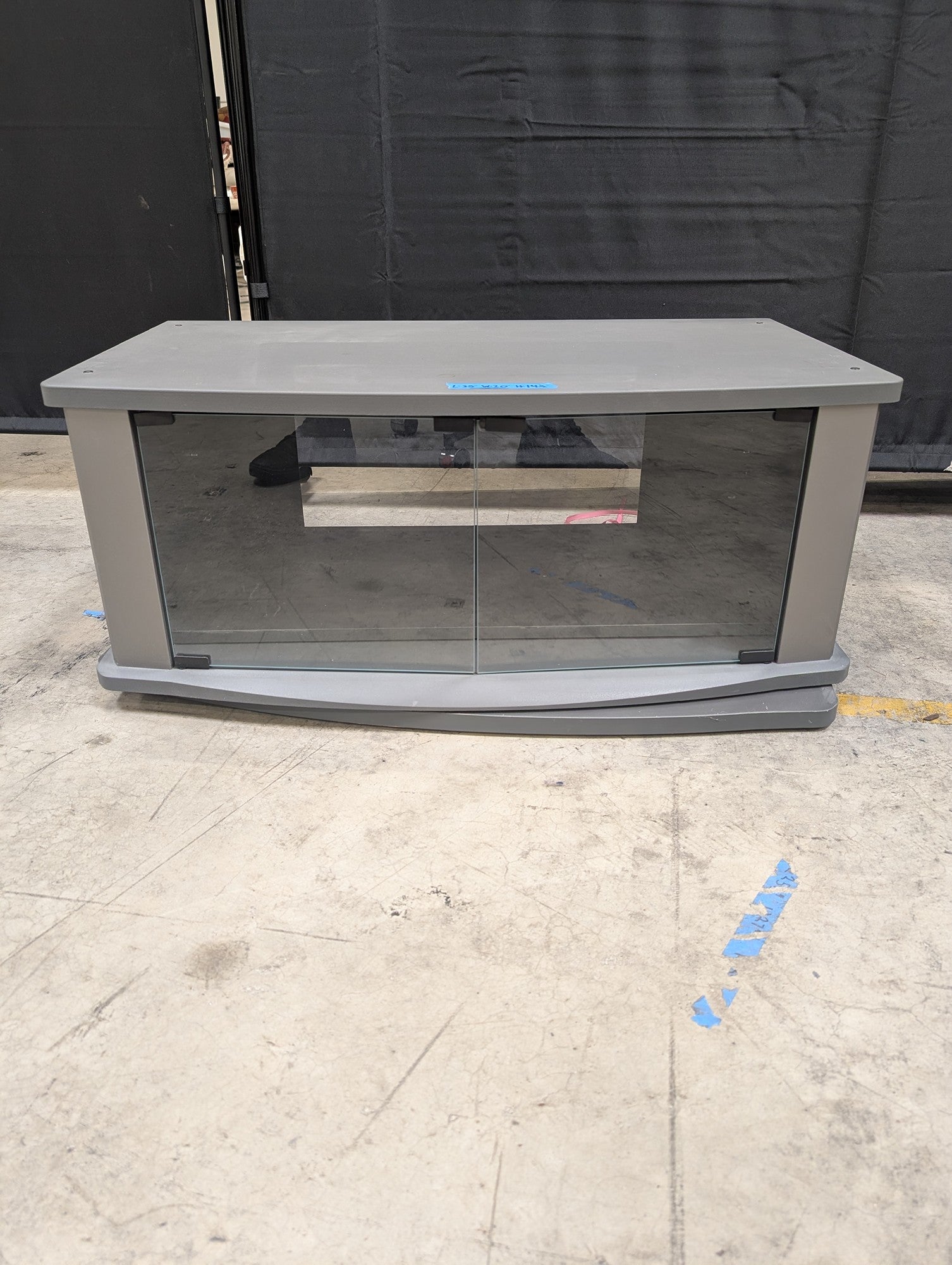 Gray Wood Composite TV Stand with Glass Doors