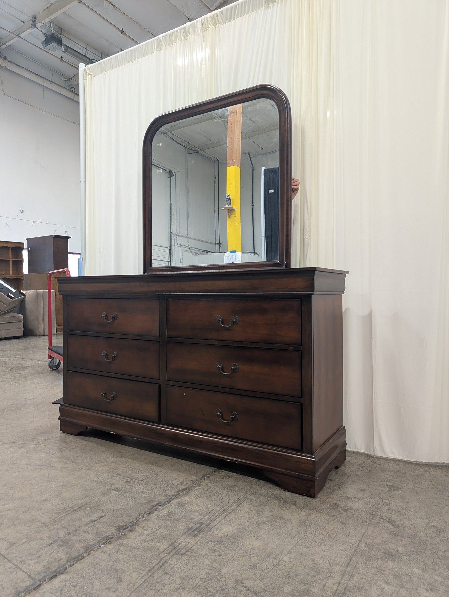 Dark Wood Six-Drawer Dresser with Rounded Mirror