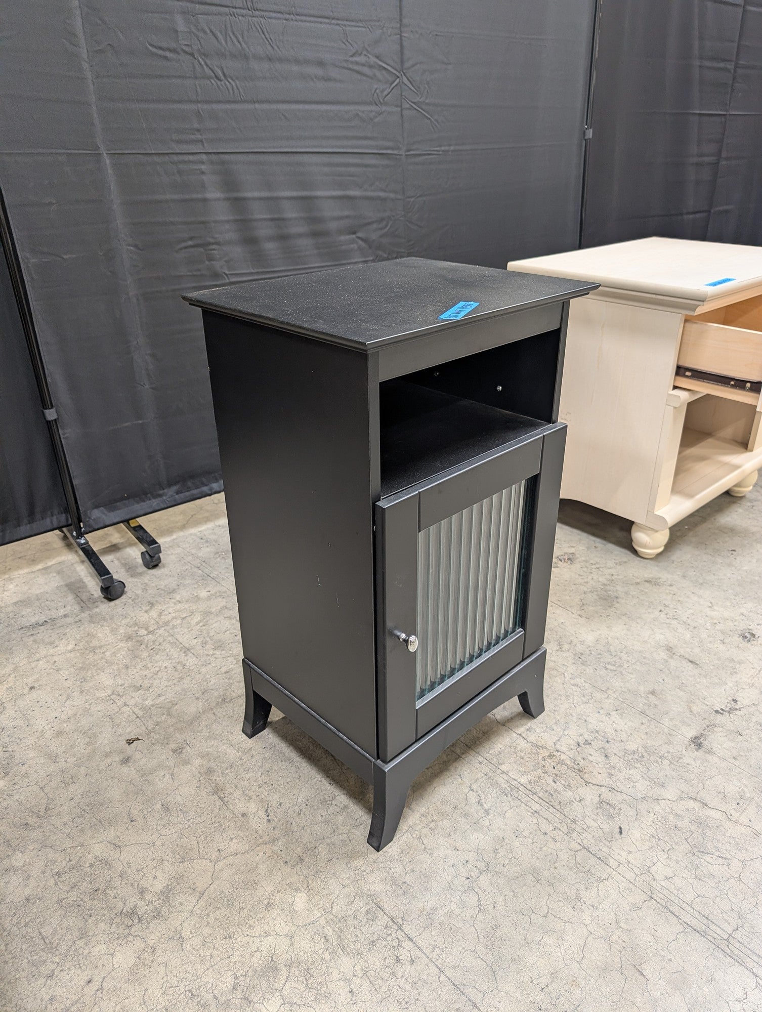 Black Wood Nightstand with Ribbed Panel Door