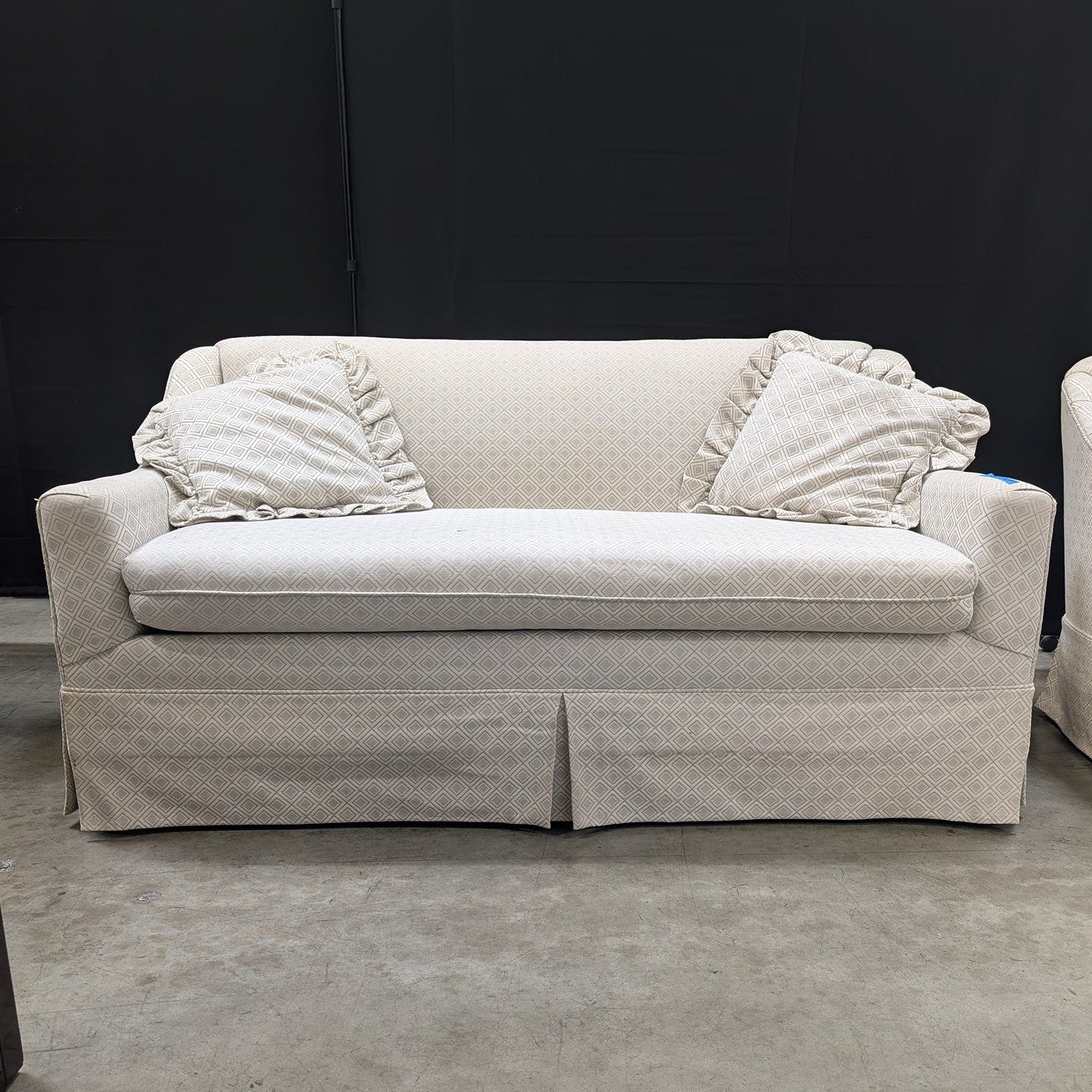 Neutral Patterned Upholstered Loveseat with Skirted Base