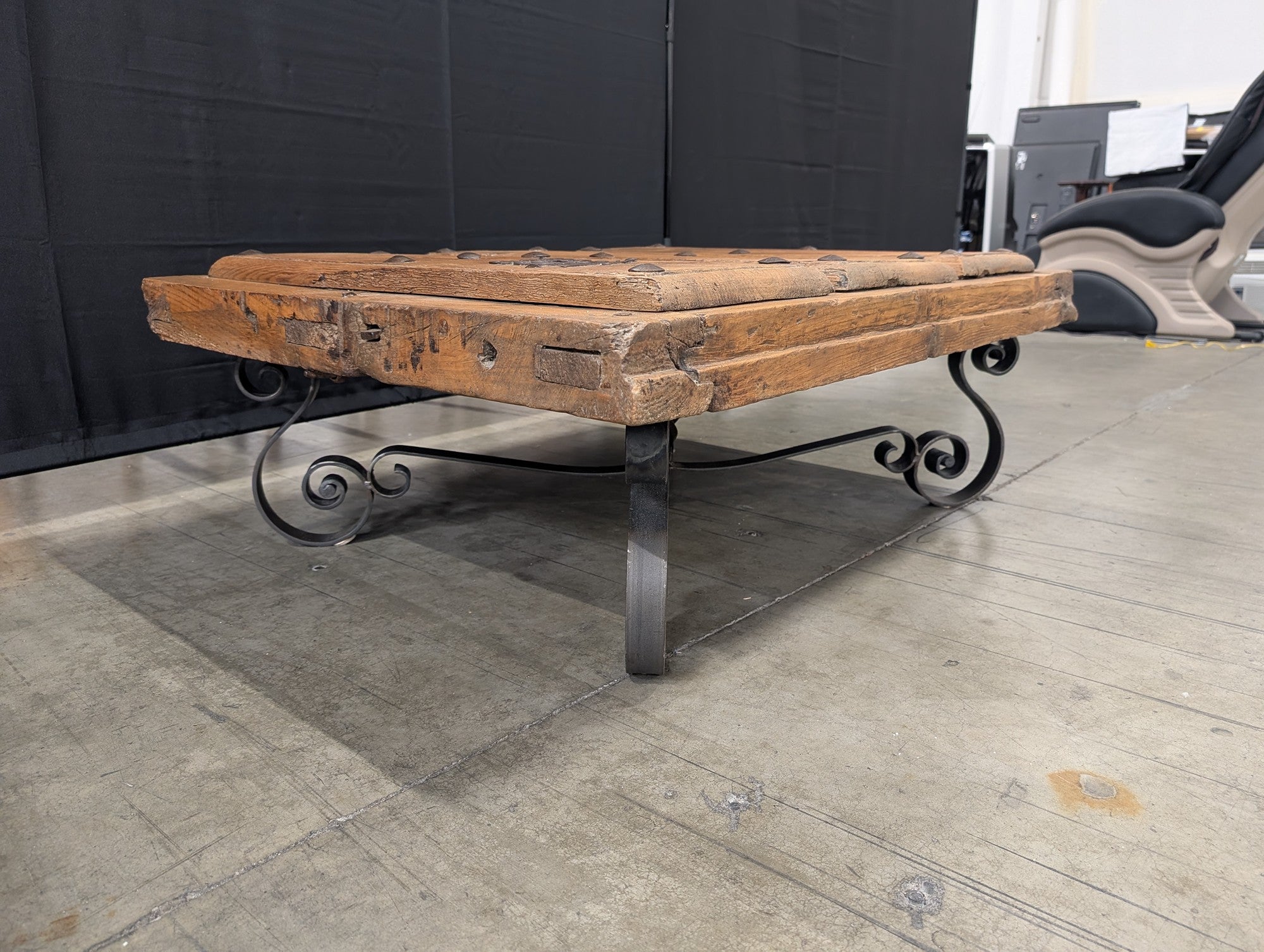 Rustic Plank Top Wood Coffee Table with Ornate Iron Base