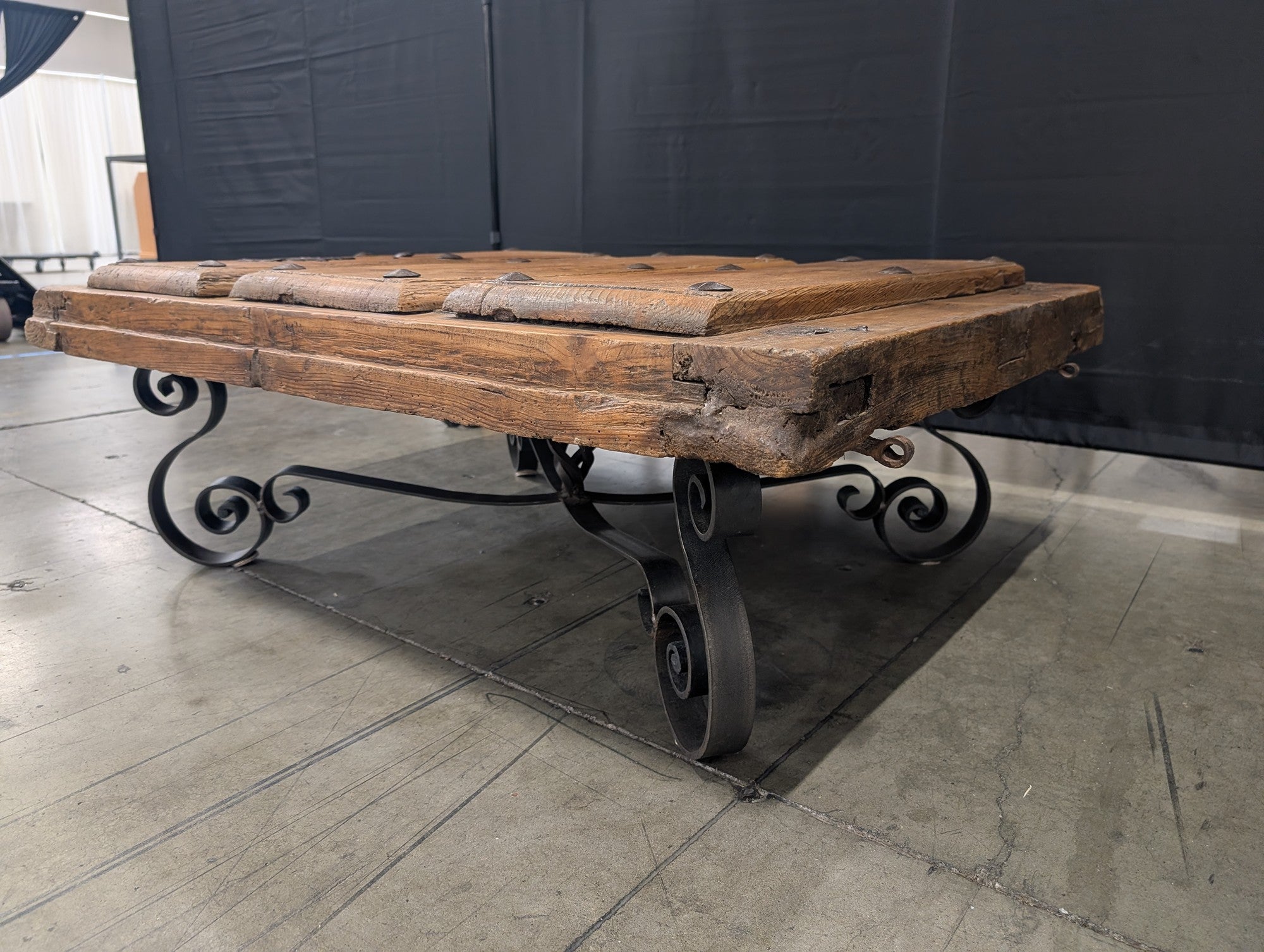 Rustic Plank Top Wood Coffee Table with Ornate Iron Base