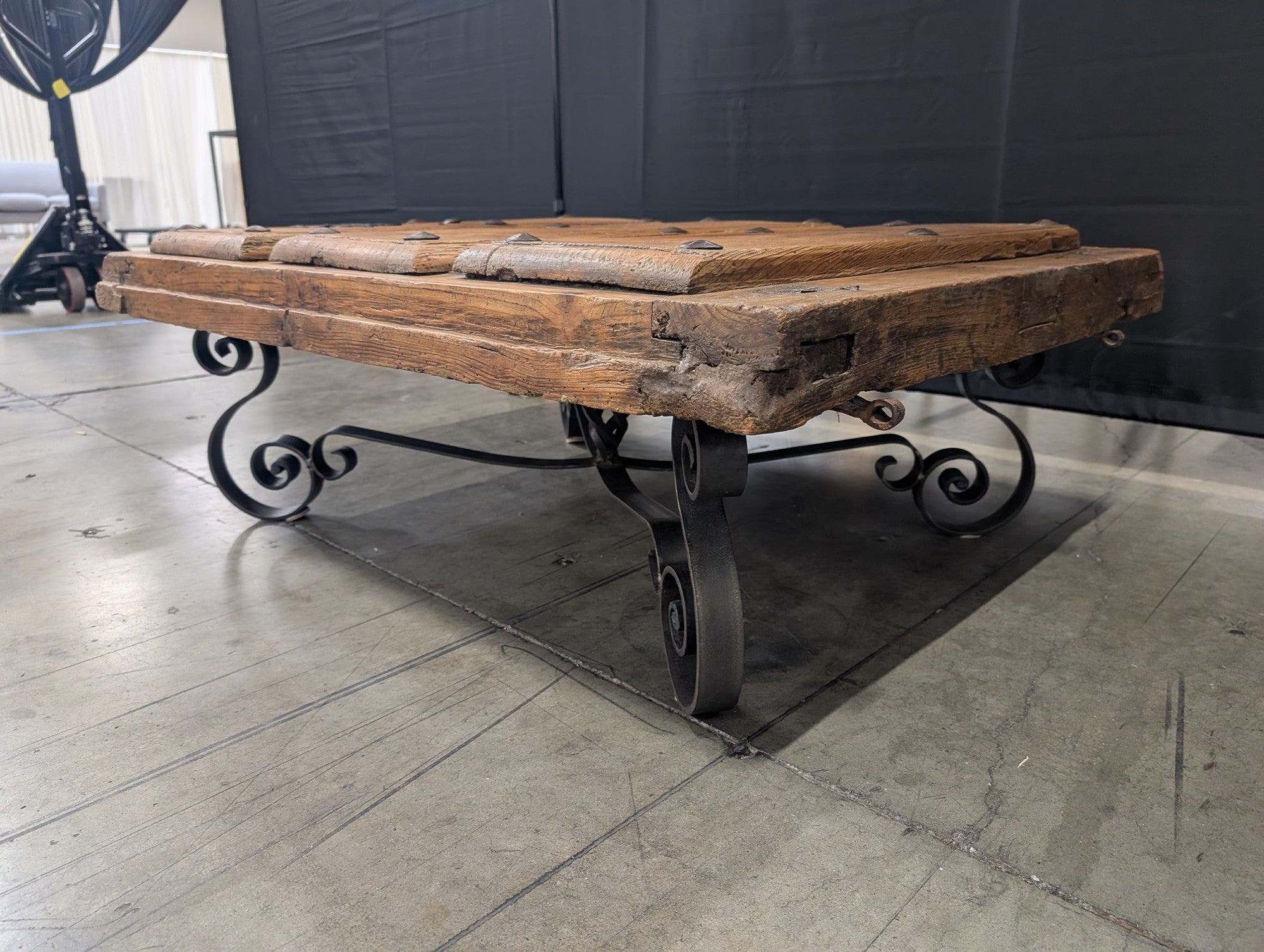 Rustic Plank Top Wood Coffee Table with Ornate Iron Base