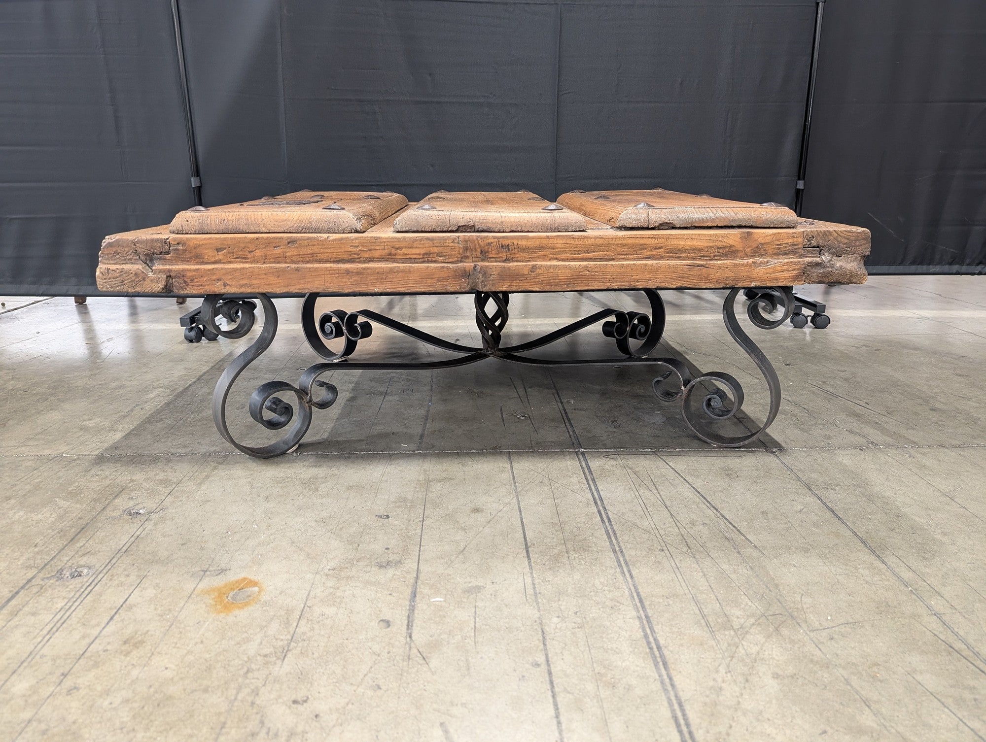 Rustic Plank Top Wood Coffee Table with Ornate Iron Base