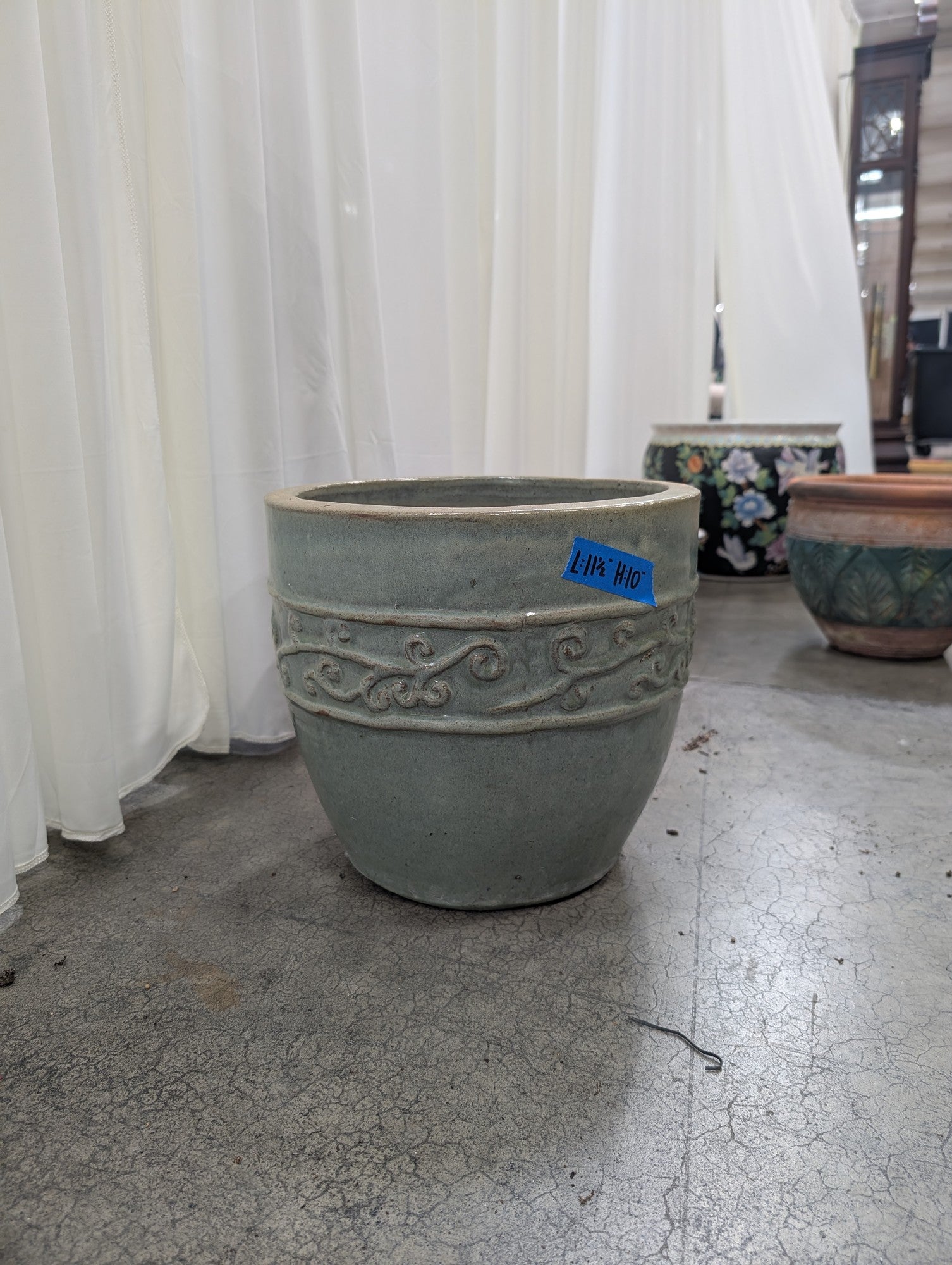 Grey-Green Ceramic Planter with Embossed Scroll Design