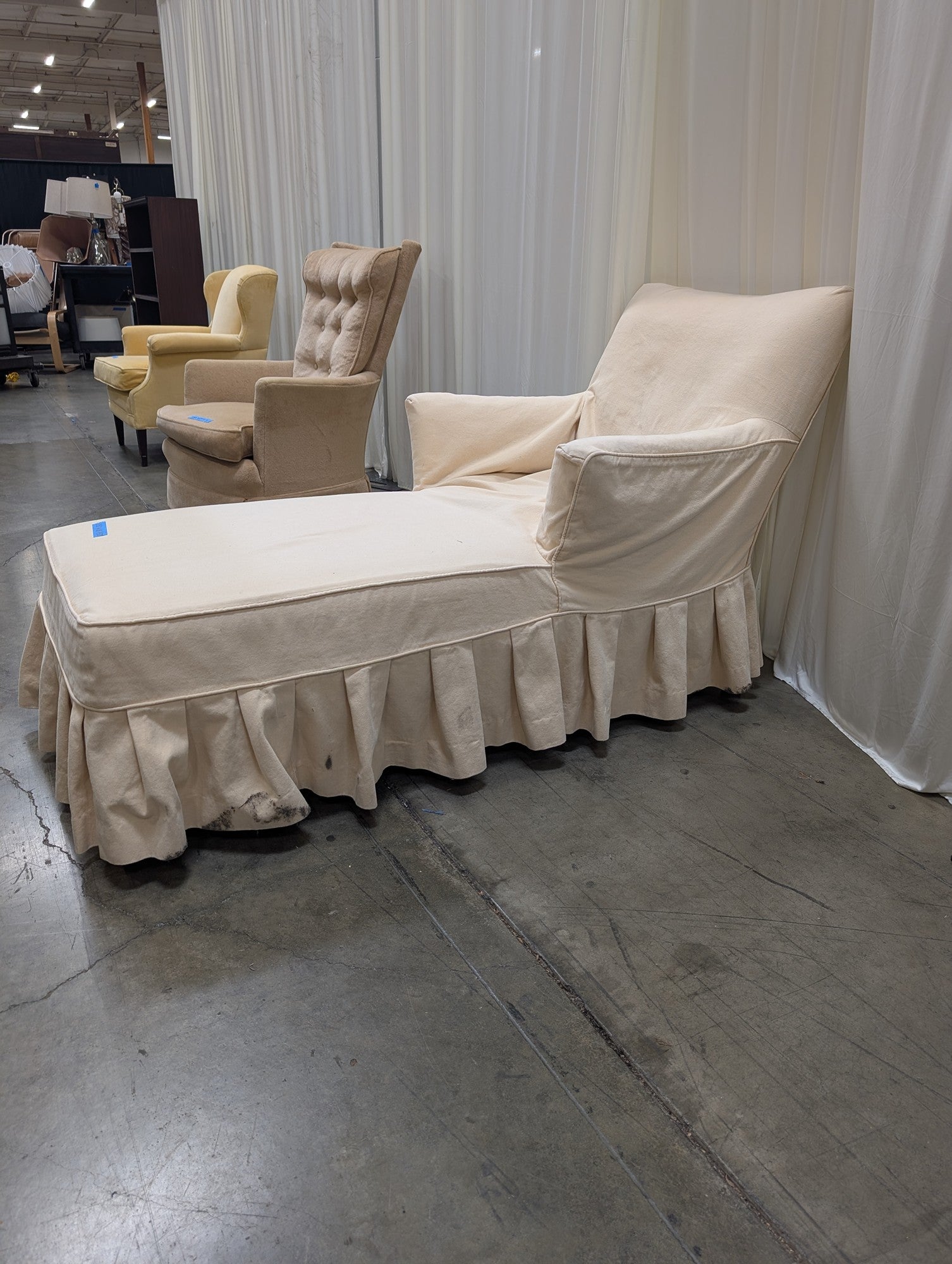 Cream Fabric Chaise Lounge with Ruffled Skirt