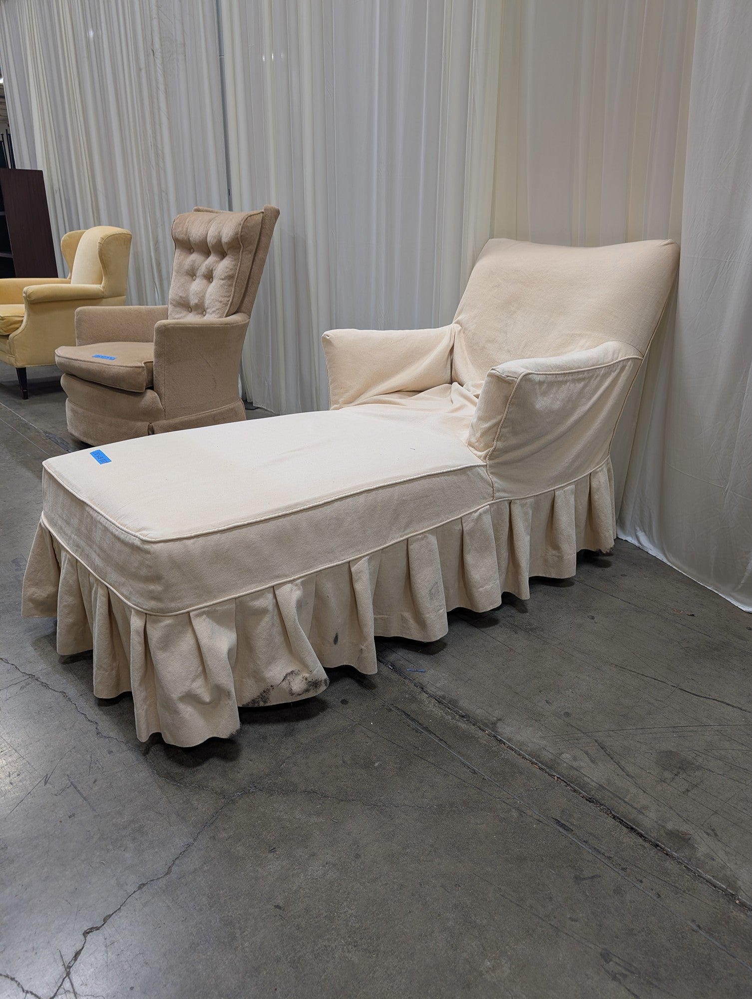 Cream Fabric Chaise Lounge with Ruffled Skirt