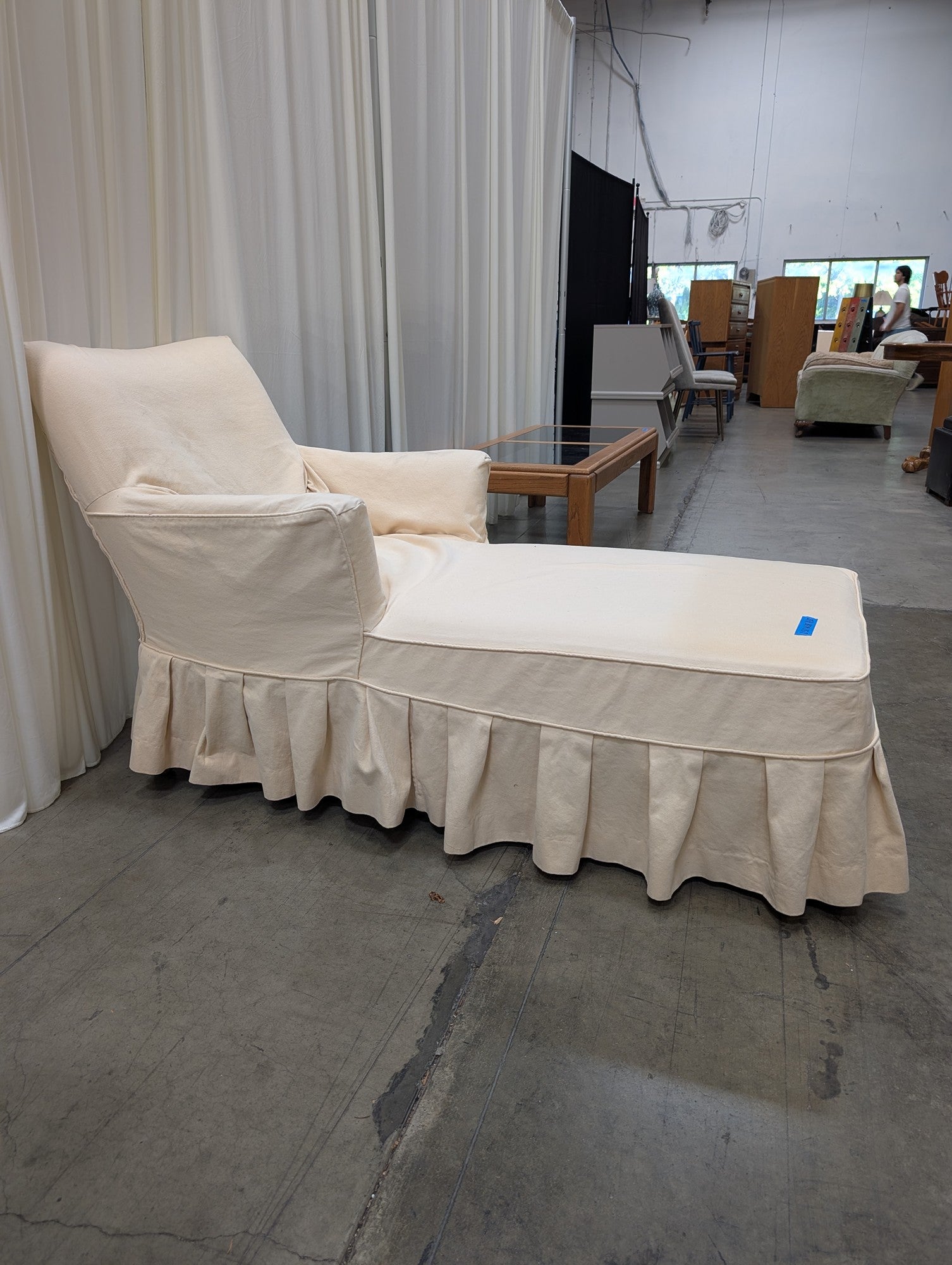 Cream Fabric Chaise Lounge with Ruffled Skirt