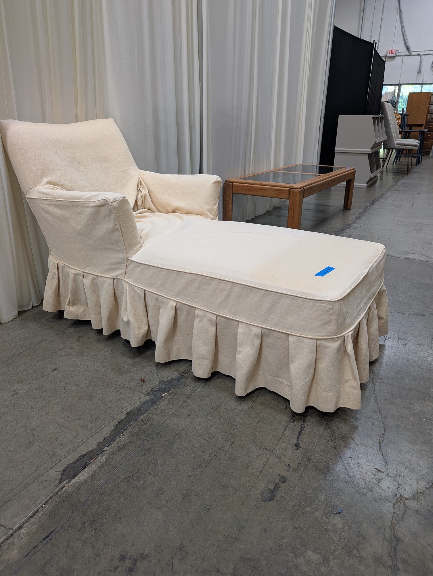 Cream Fabric Chaise Lounge with Ruffled Skirt