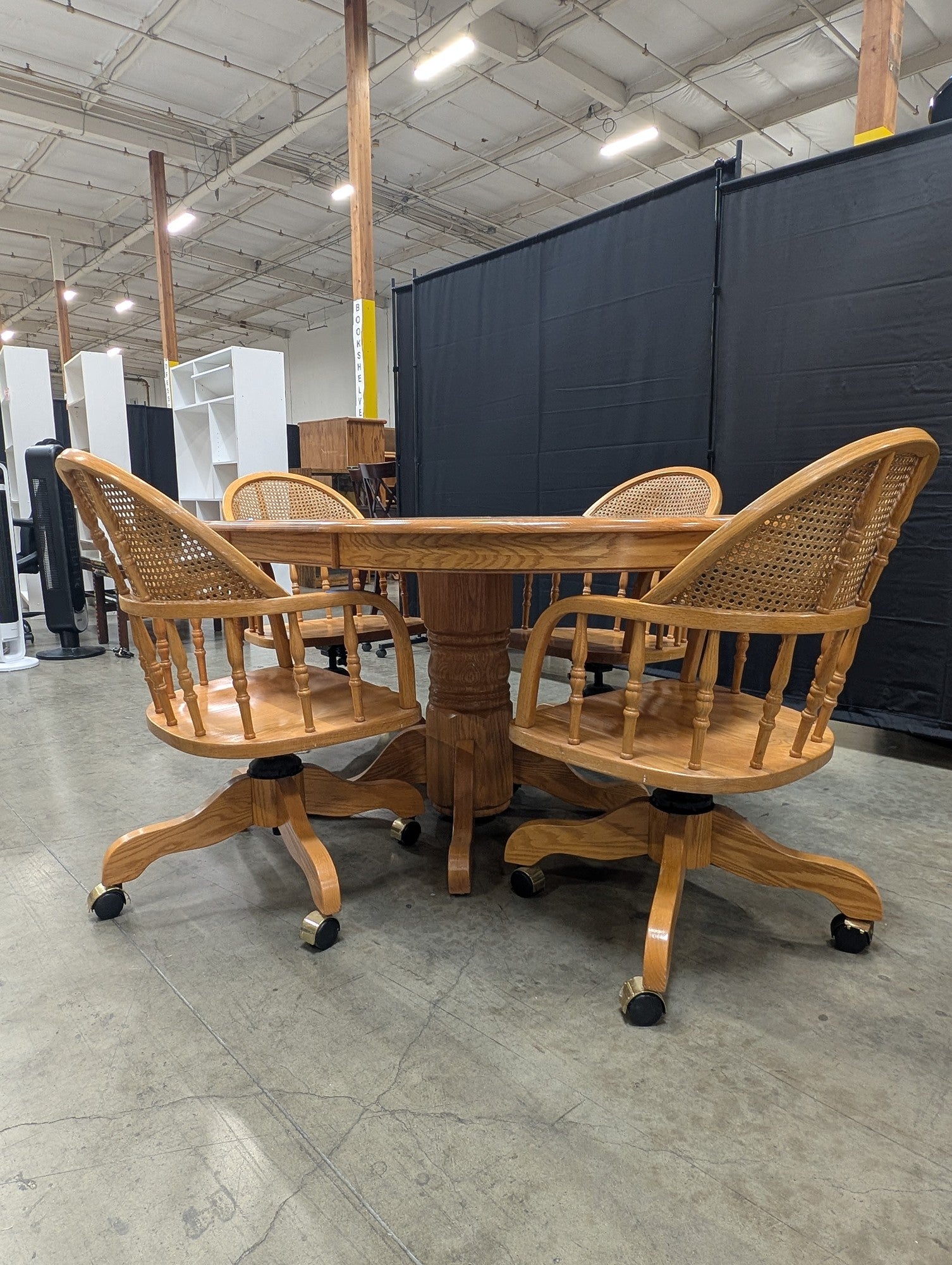 Set with Four Cane Back A-America Furniture Chairs with a Oval Wood Dining Table