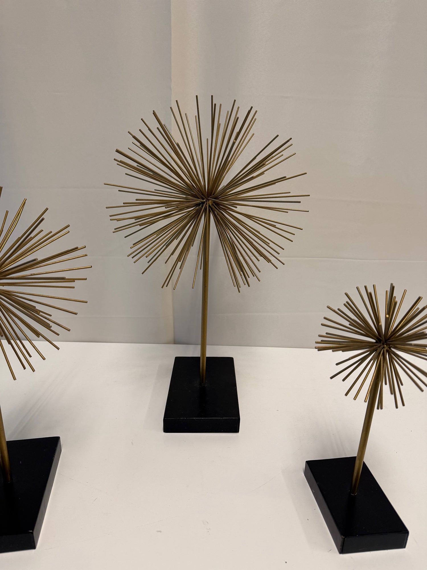 Three Gold Starburst Table Sculptures with Black Base Set