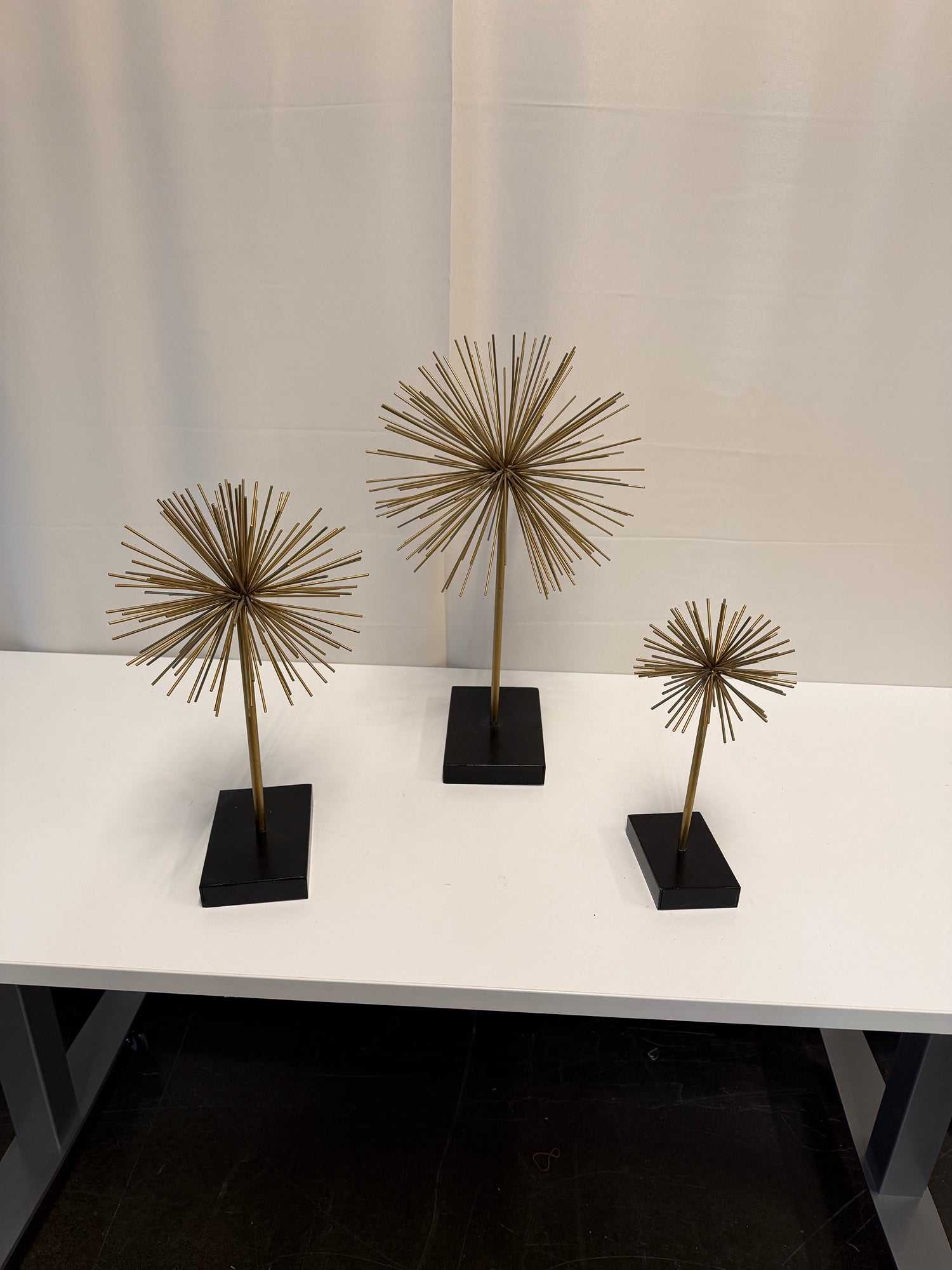 Three Gold Starburst Table Sculptures with Black Base Set