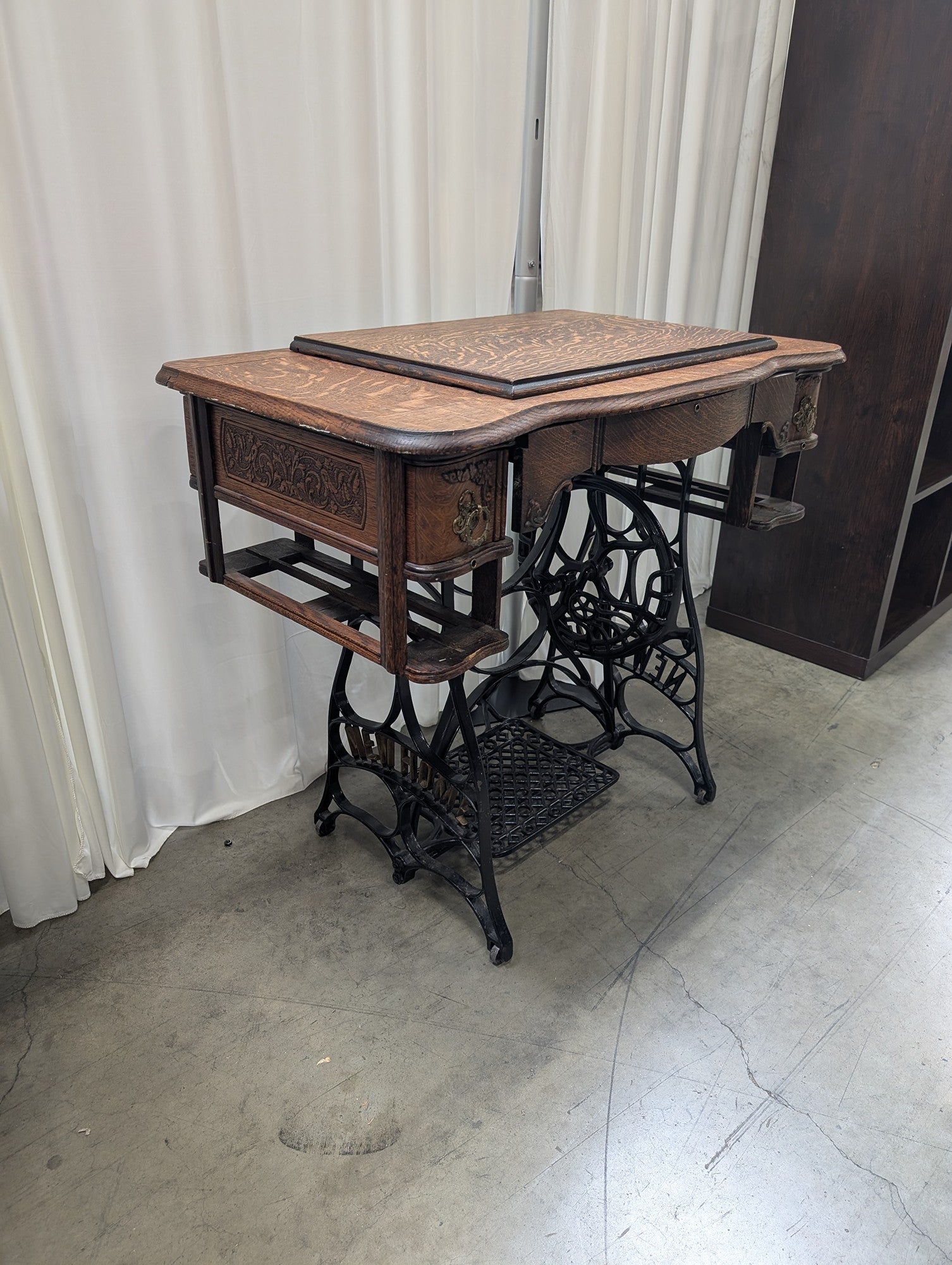 Antique NEW HOME Wood Sewing Machine Cabinet with Ornate Cast Iron Base