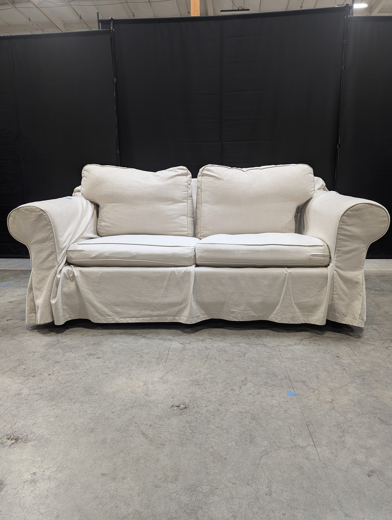 Light Beige Slipcovered Rolled Arm Couch
