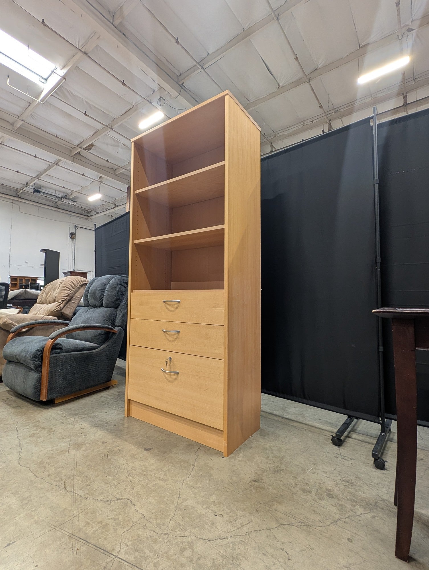 Versatile Light Wood Bookcase with Three Drawers