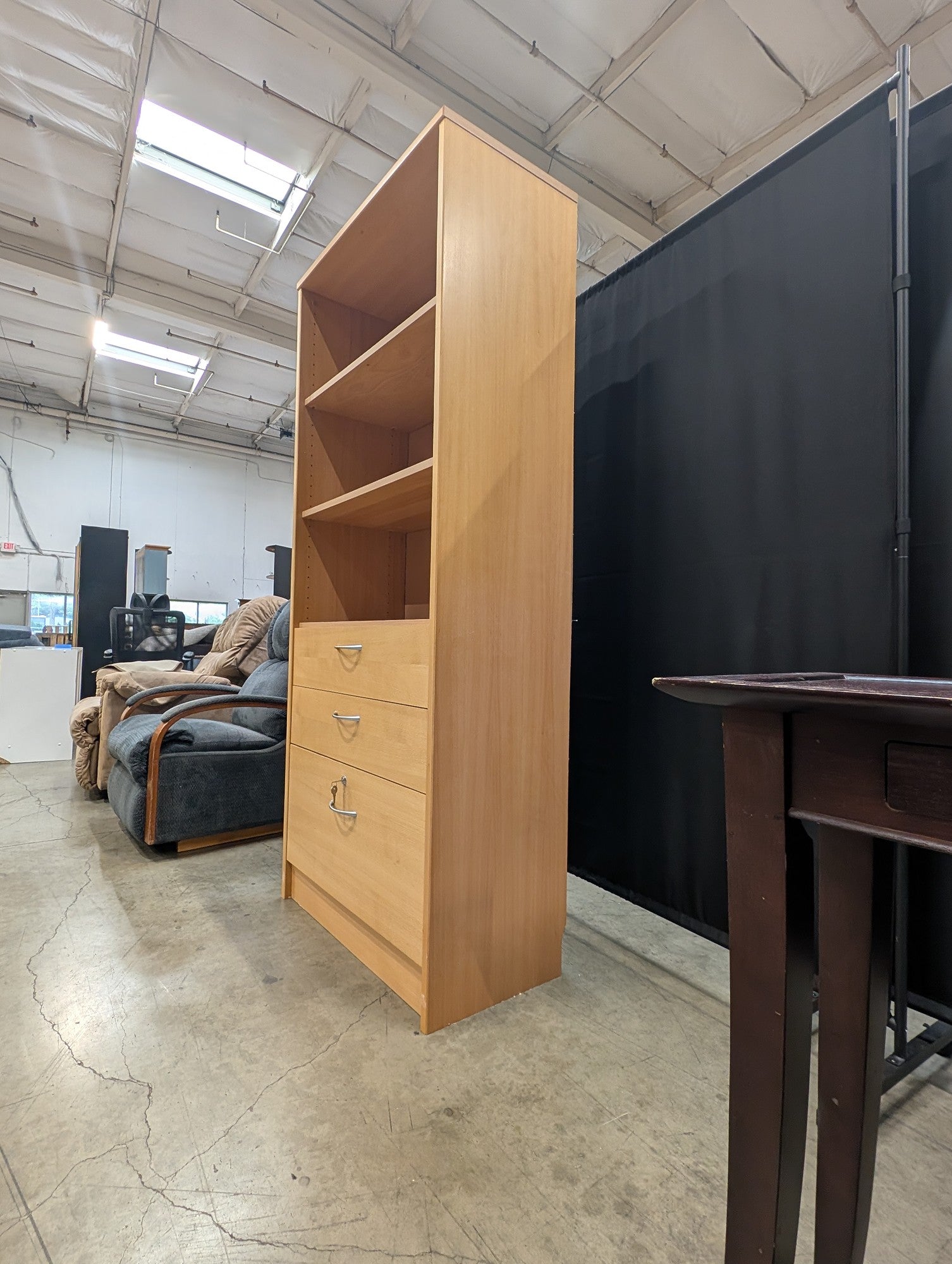 Versatile Light Wood Bookcase with Three Drawers