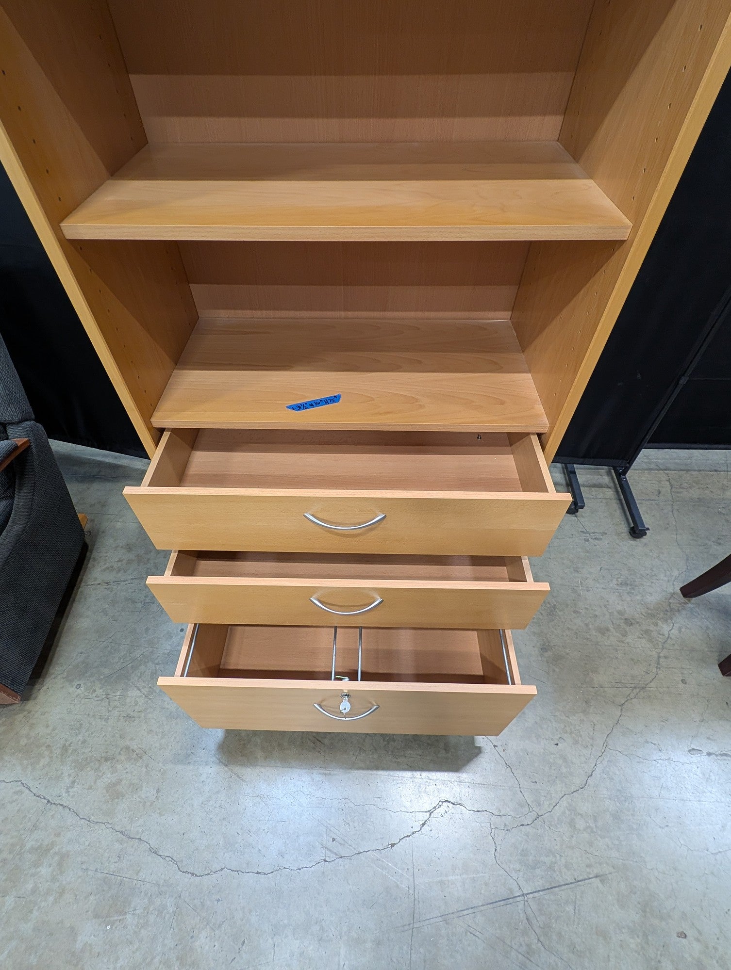 Versatile Light Wood Bookcase with Three Drawers