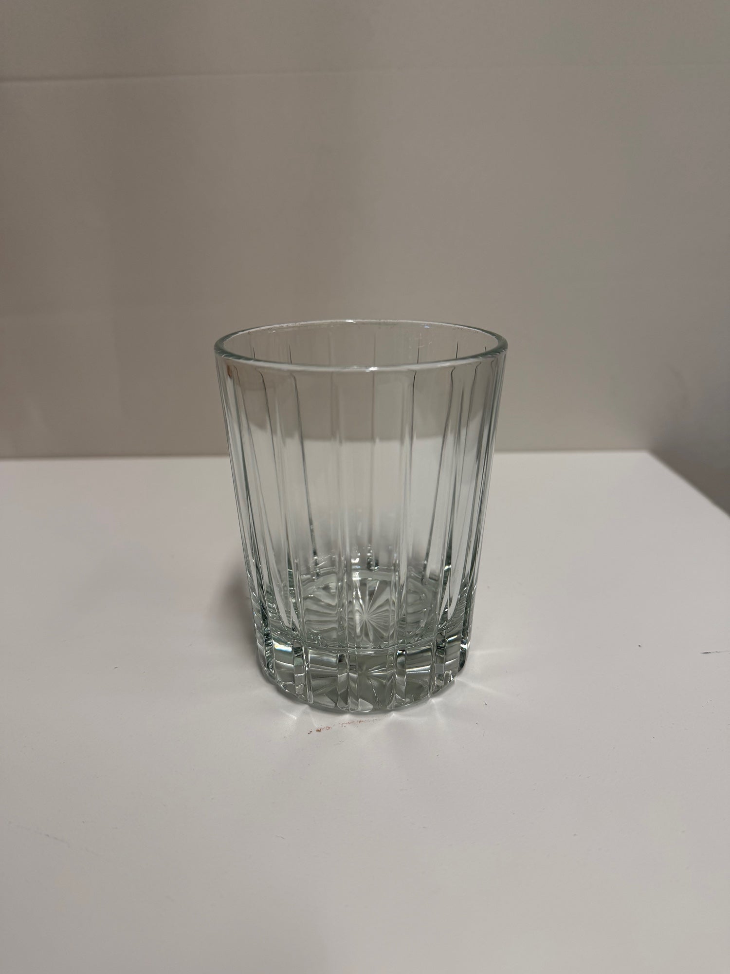 Clear Ribbed Glass Tumbler with Starburst Base