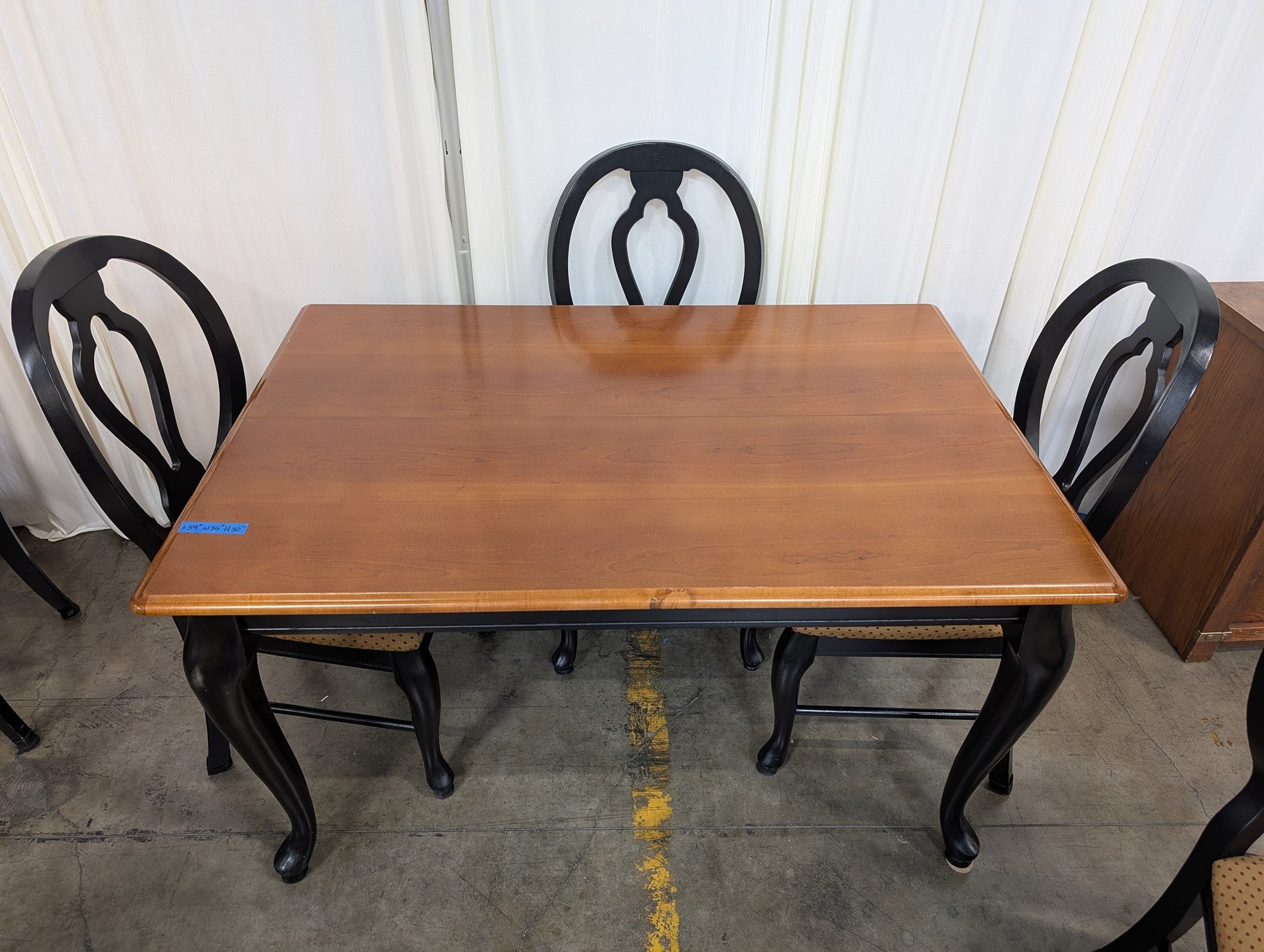 Two-Tone Wood Dining Table with Black Chairs