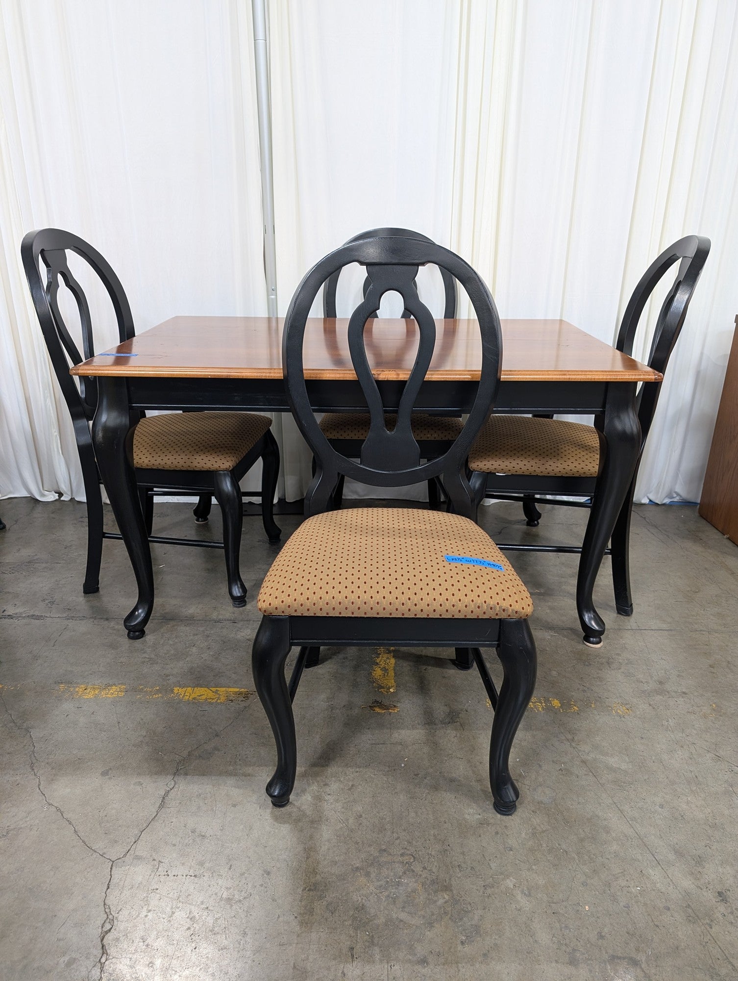 Two-Tone Wood Dining Table with Black Chairs