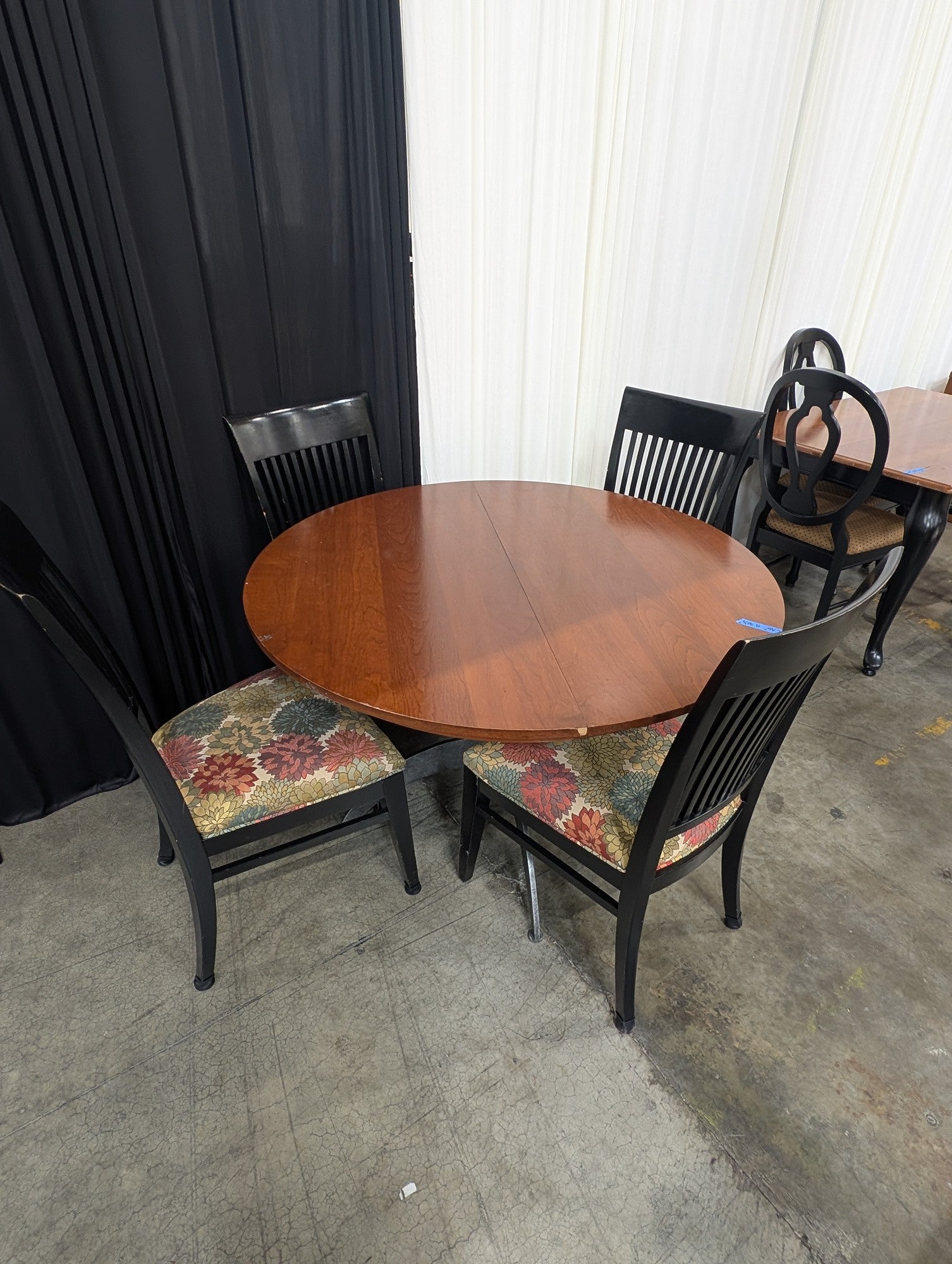 Round Wood Dining Table with Four Ethan Allen Black Chairs