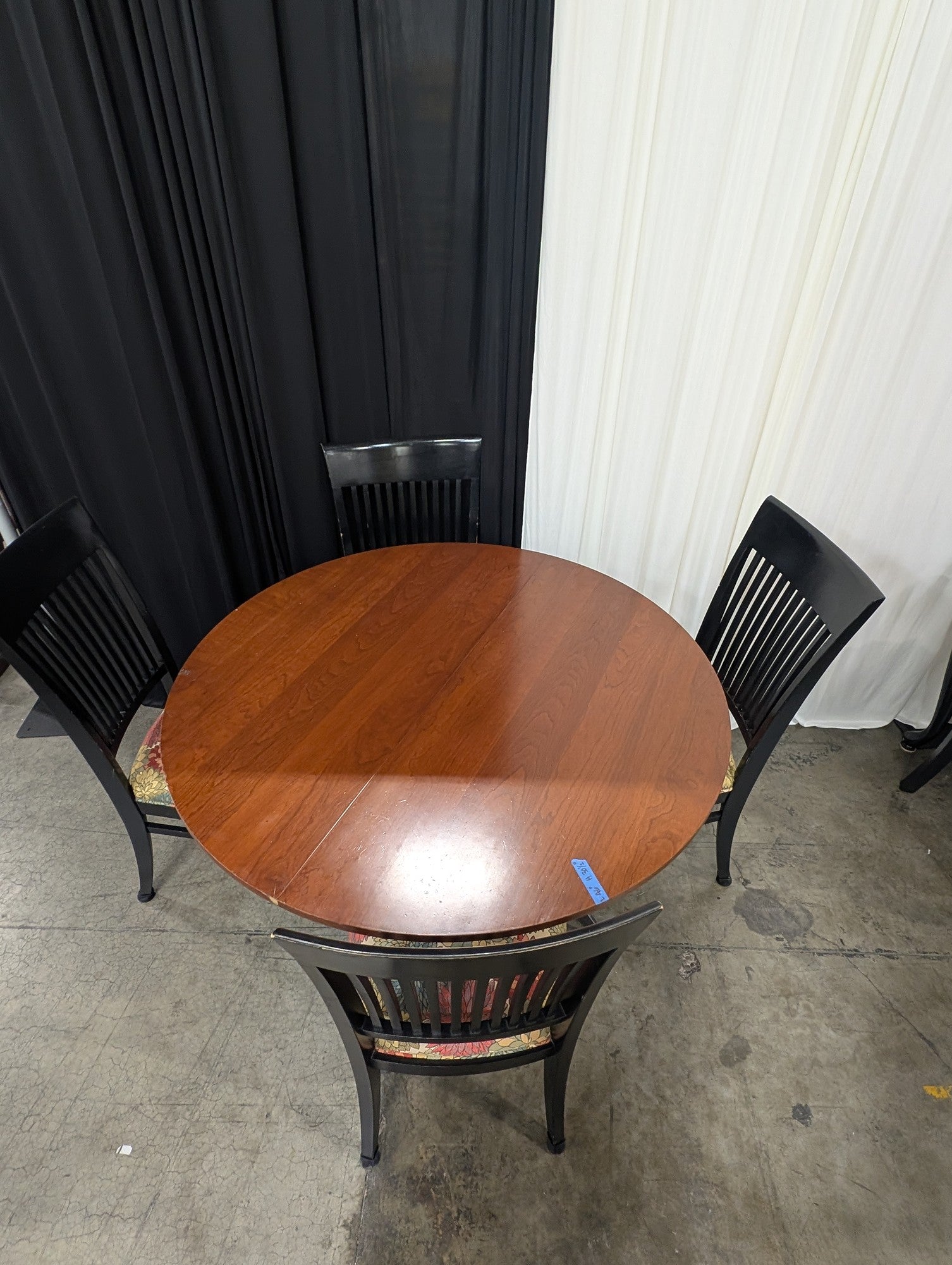 Round Wood Dining Table with Four Ethan Allen Black Chairs