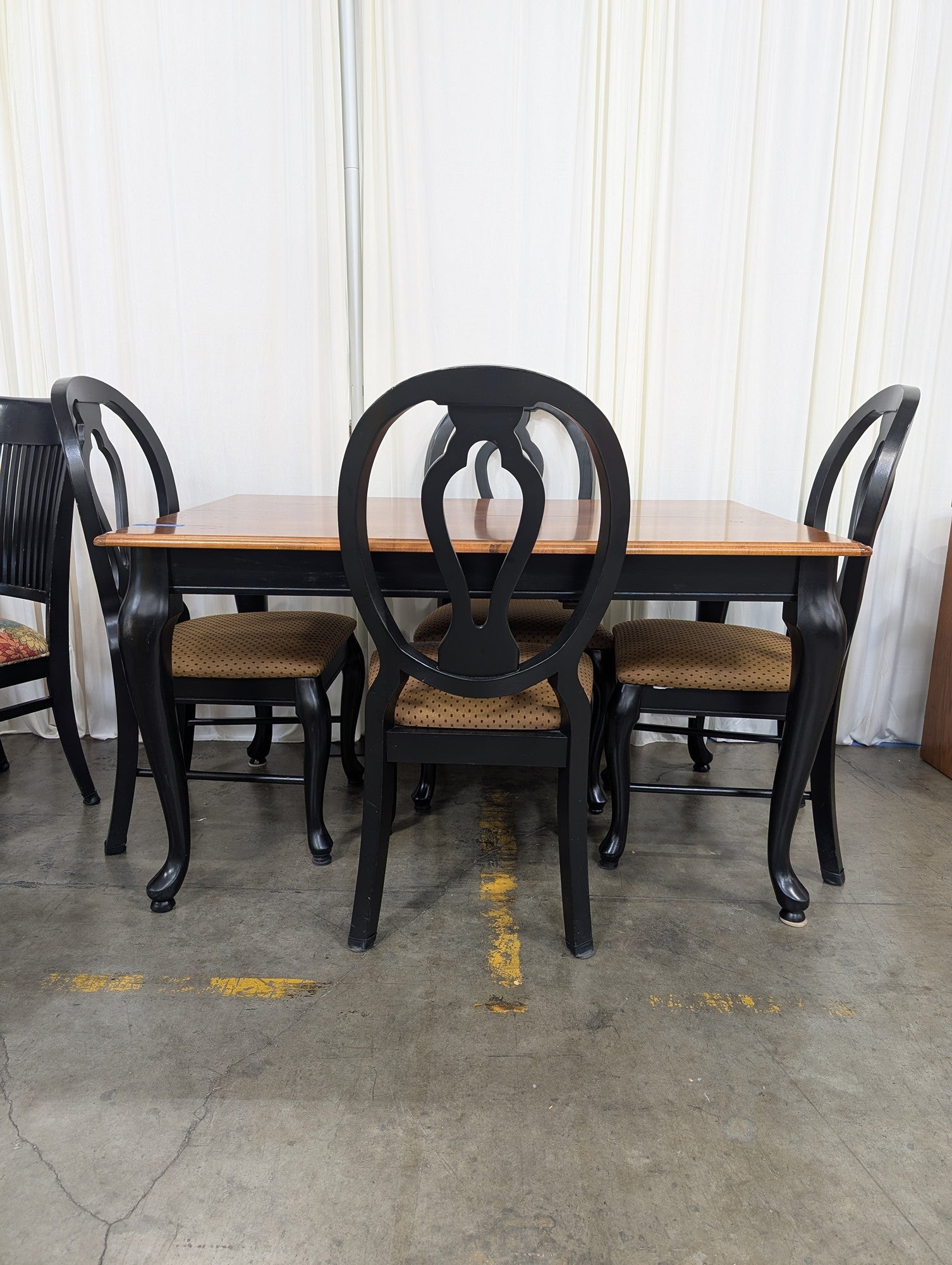 Two-Tone Wood Dining Table with Black Chairs
