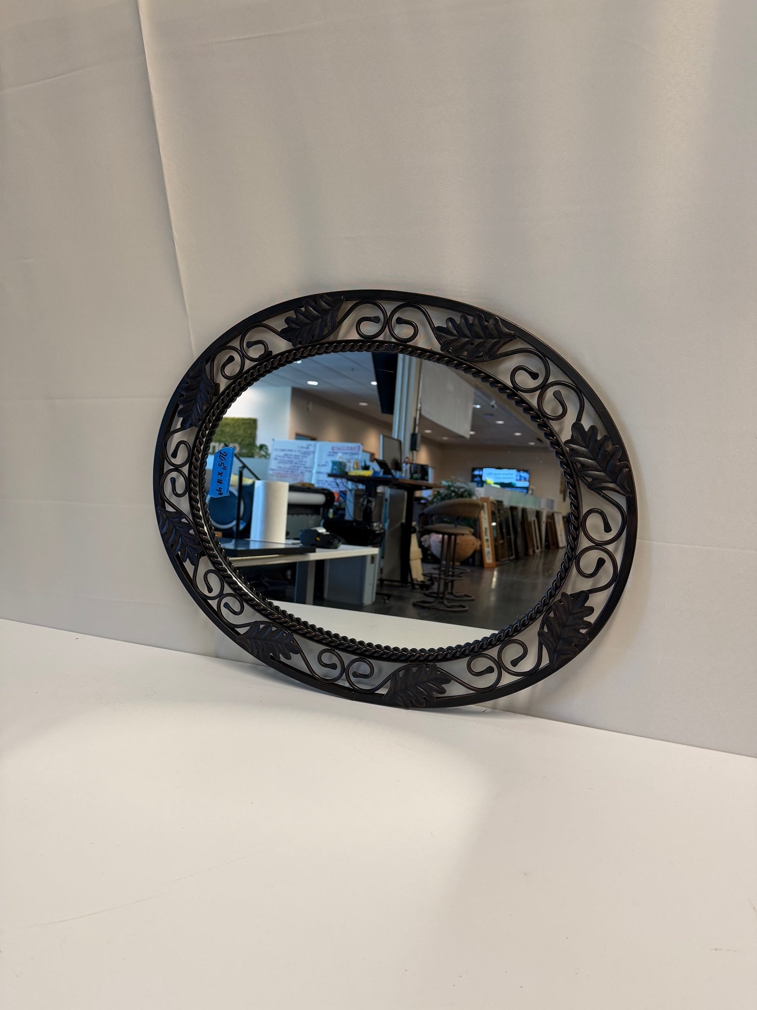 Ornate Oval Wall Mirror with Leaf and Scrollwork Frame