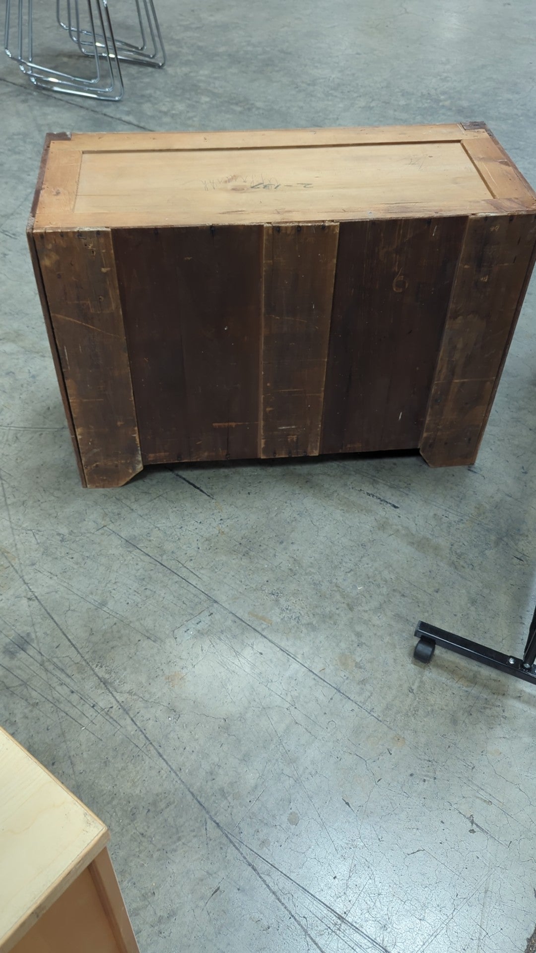 Warm Wood Three-Drawer Dresser with Ornate Hardware