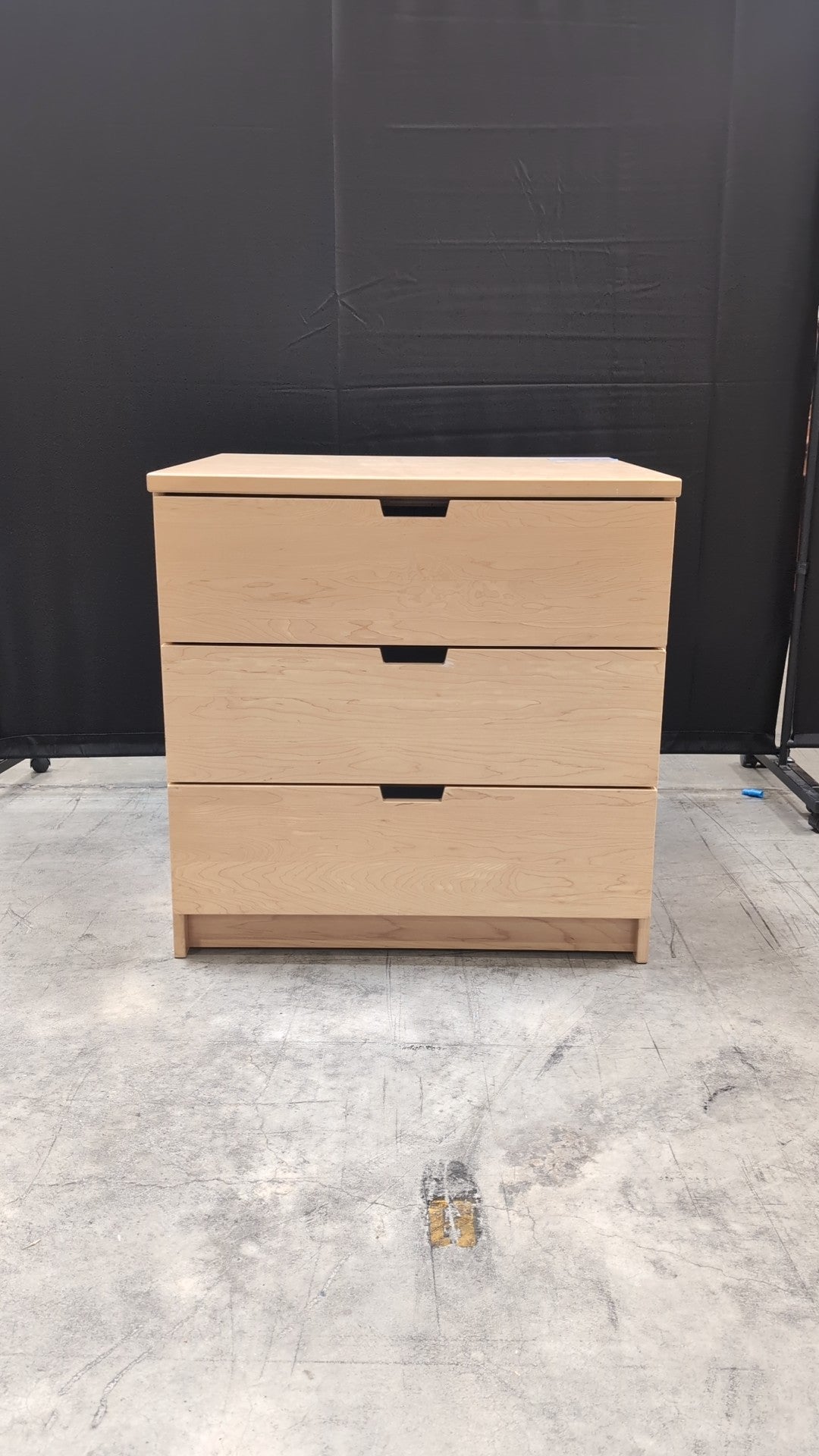 Light Wood Three-Drawer Dresser with Integrated Pulls