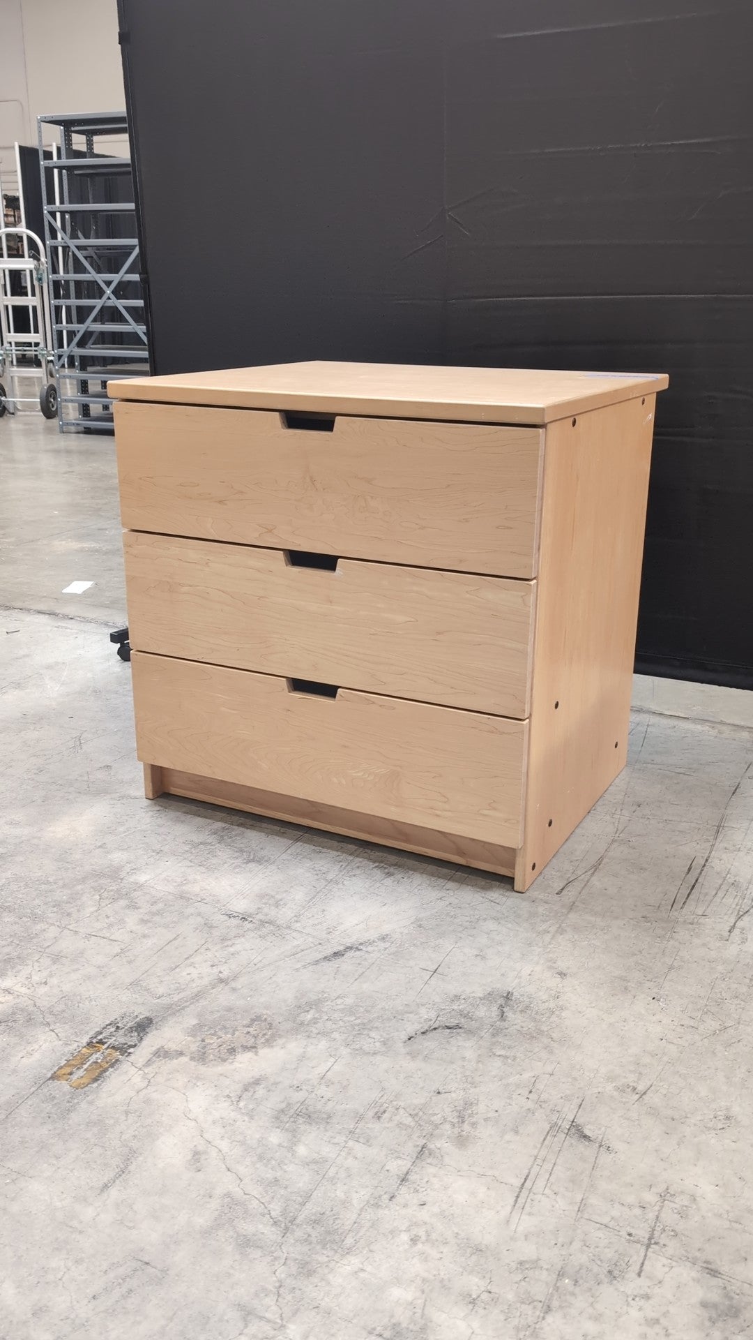 Light Wood Three-Drawer Dresser with Integrated Pulls
