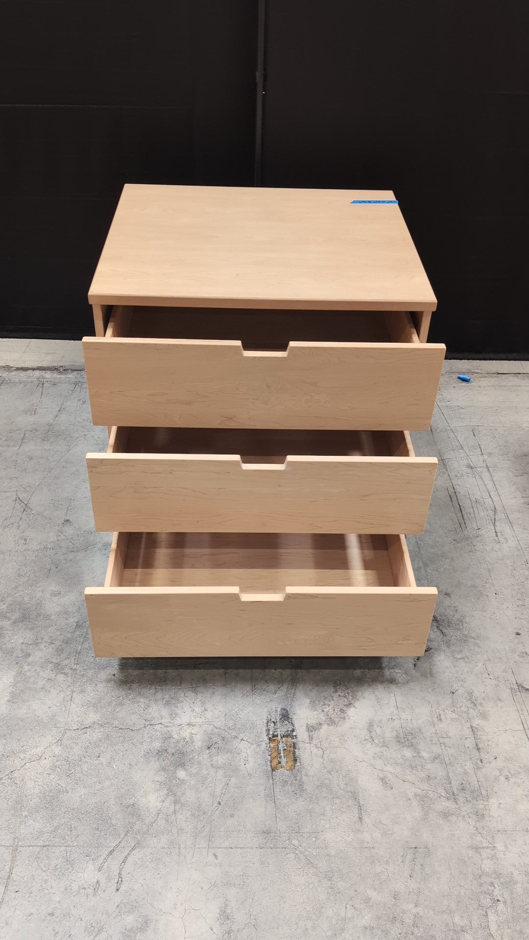 Light Wood Three-Drawer Dresser with Integrated Pulls