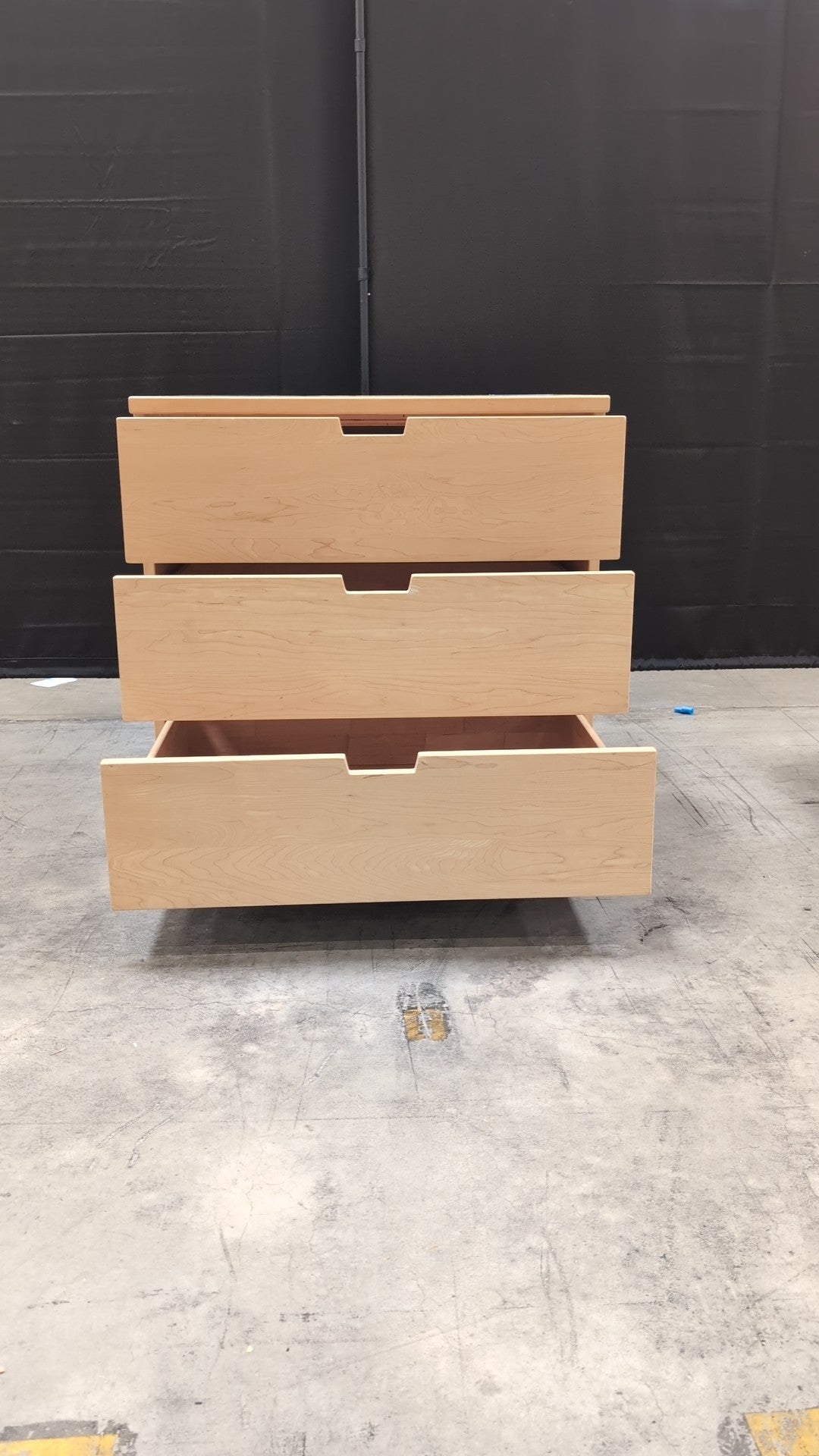 Light Wood Three-Drawer Dresser with Integrated Pulls