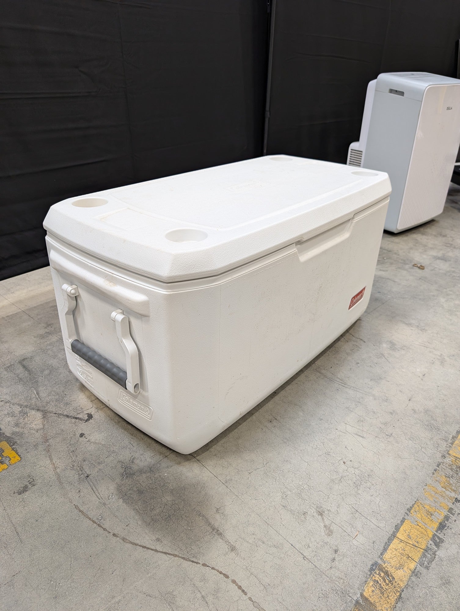 White Coleman Plastic Cooler with Cup Holders