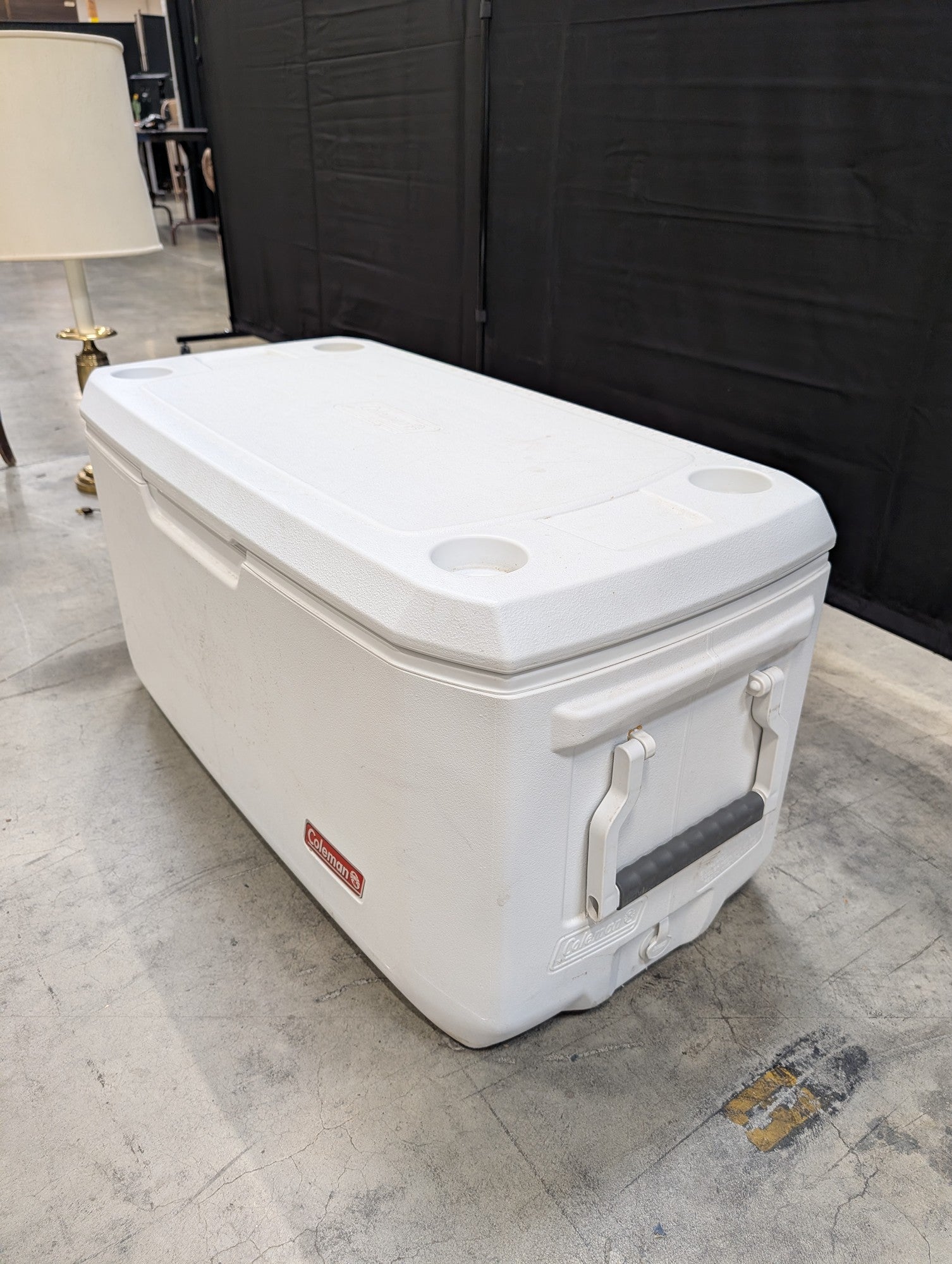 White Coleman Plastic Cooler with Cup Holders