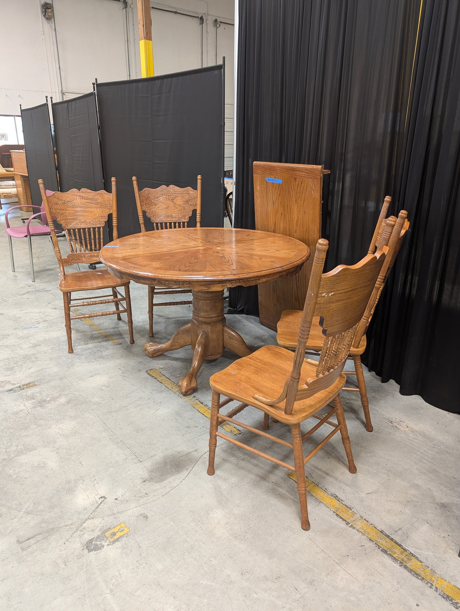 Oak-Tone Pedestal Wood Dining Table with Four Carved Chairs