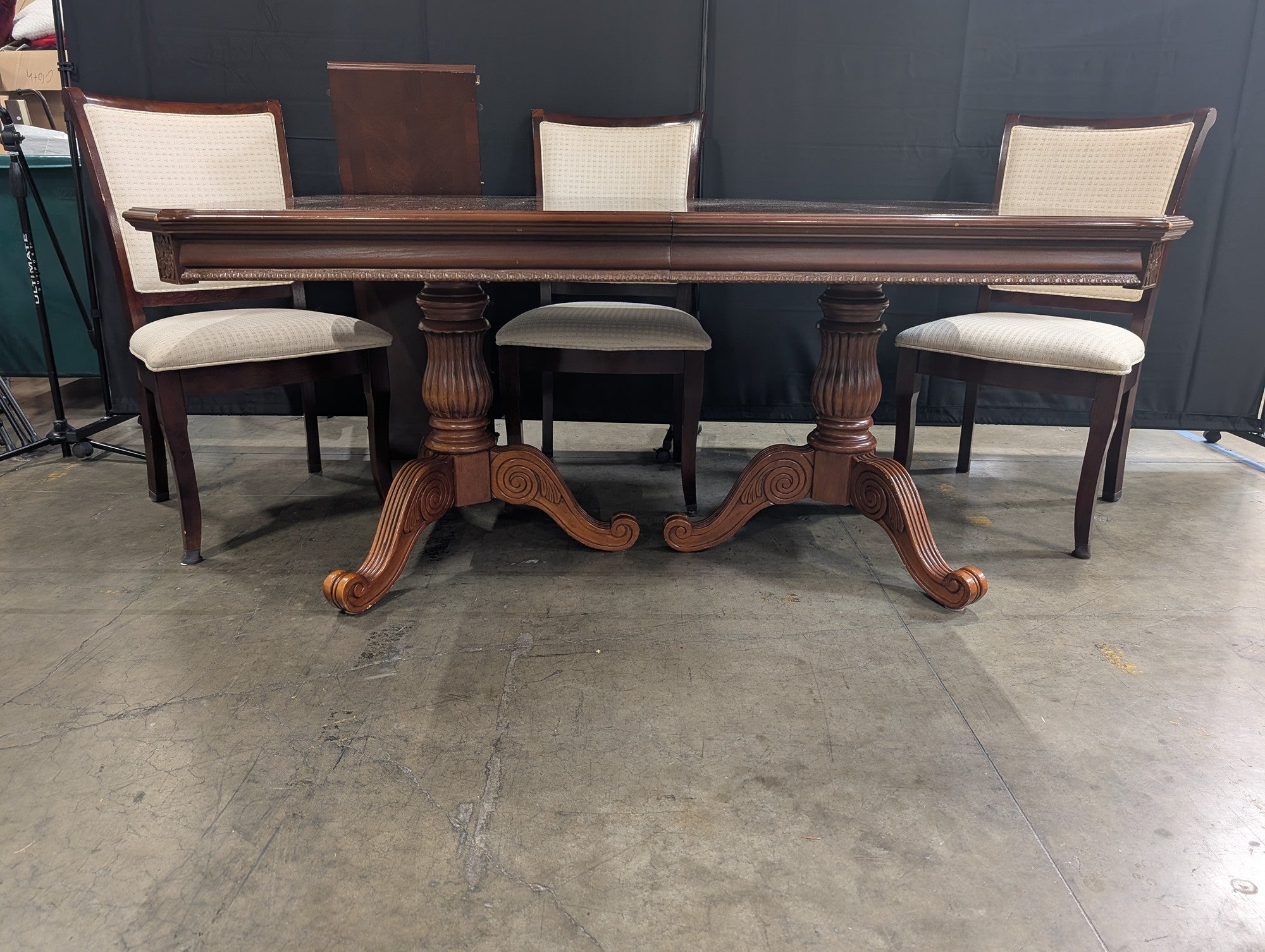 Ornate Dark Wood Pedestal Dining Table with Upholstered Chairs