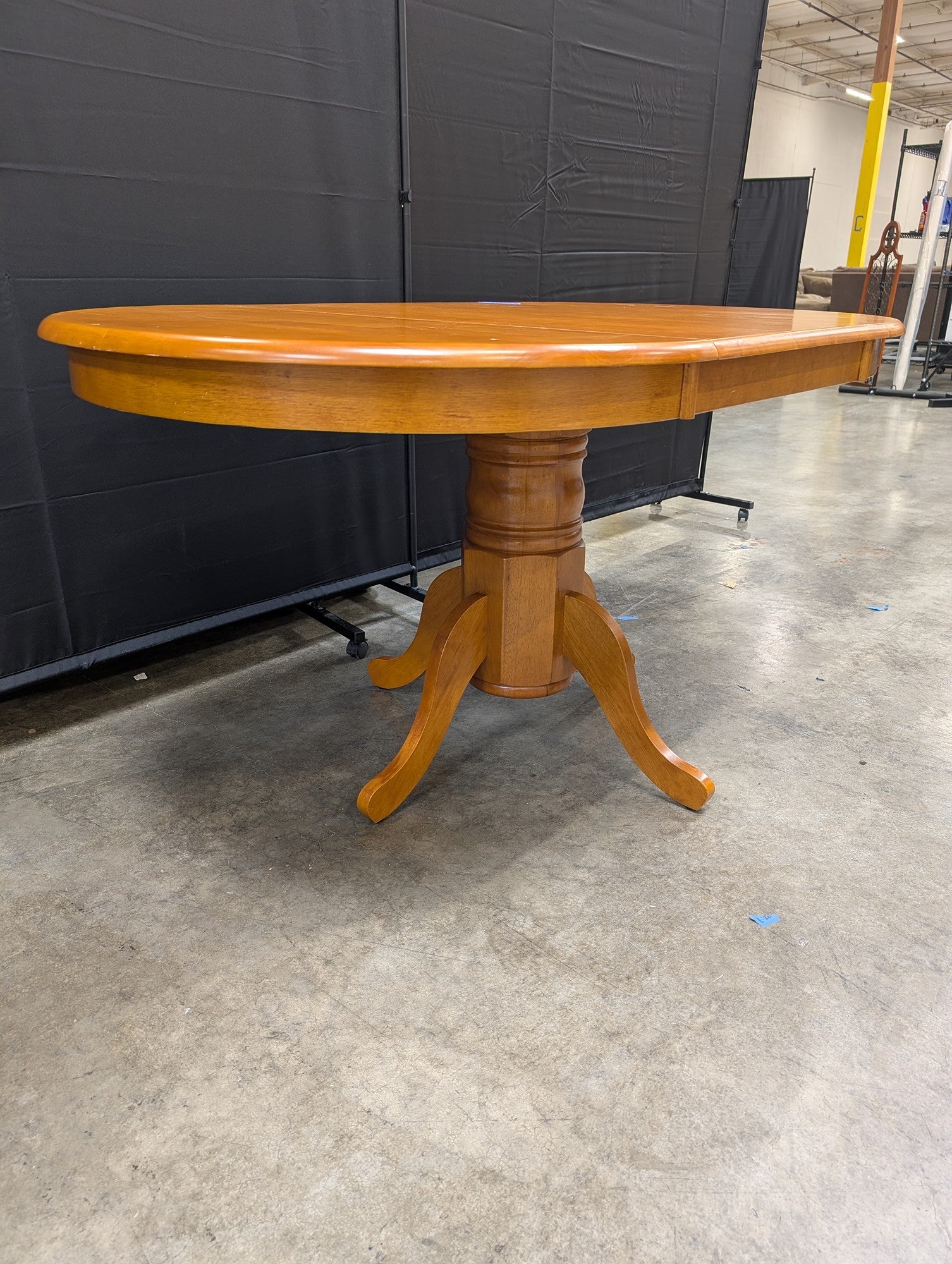 Oval Pedestal Dining Table in Warm Wood