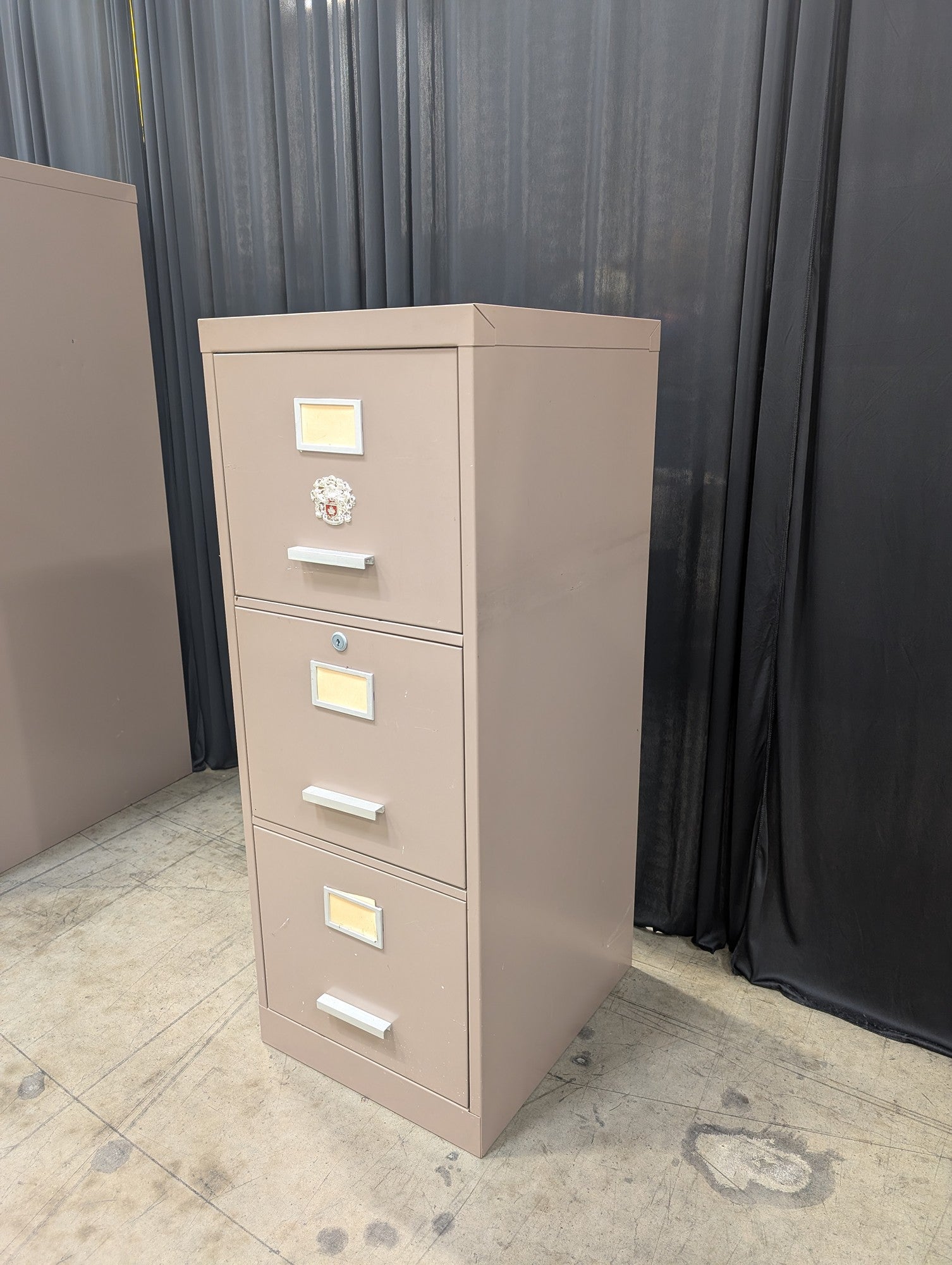 Tan Metal Three-Drawer Filing Cabinet with missing key