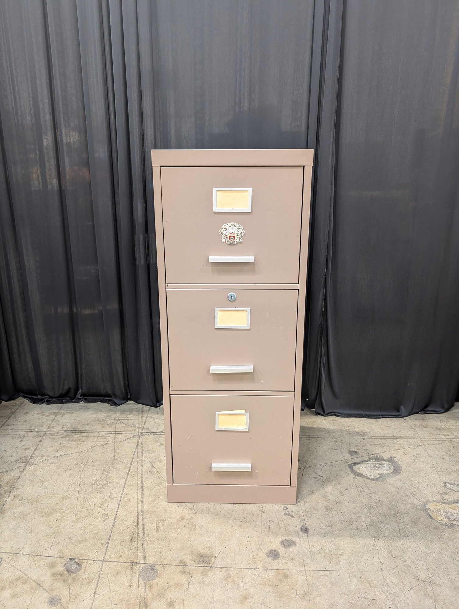 Tan Metal Three-Drawer Filing Cabinet with missing key